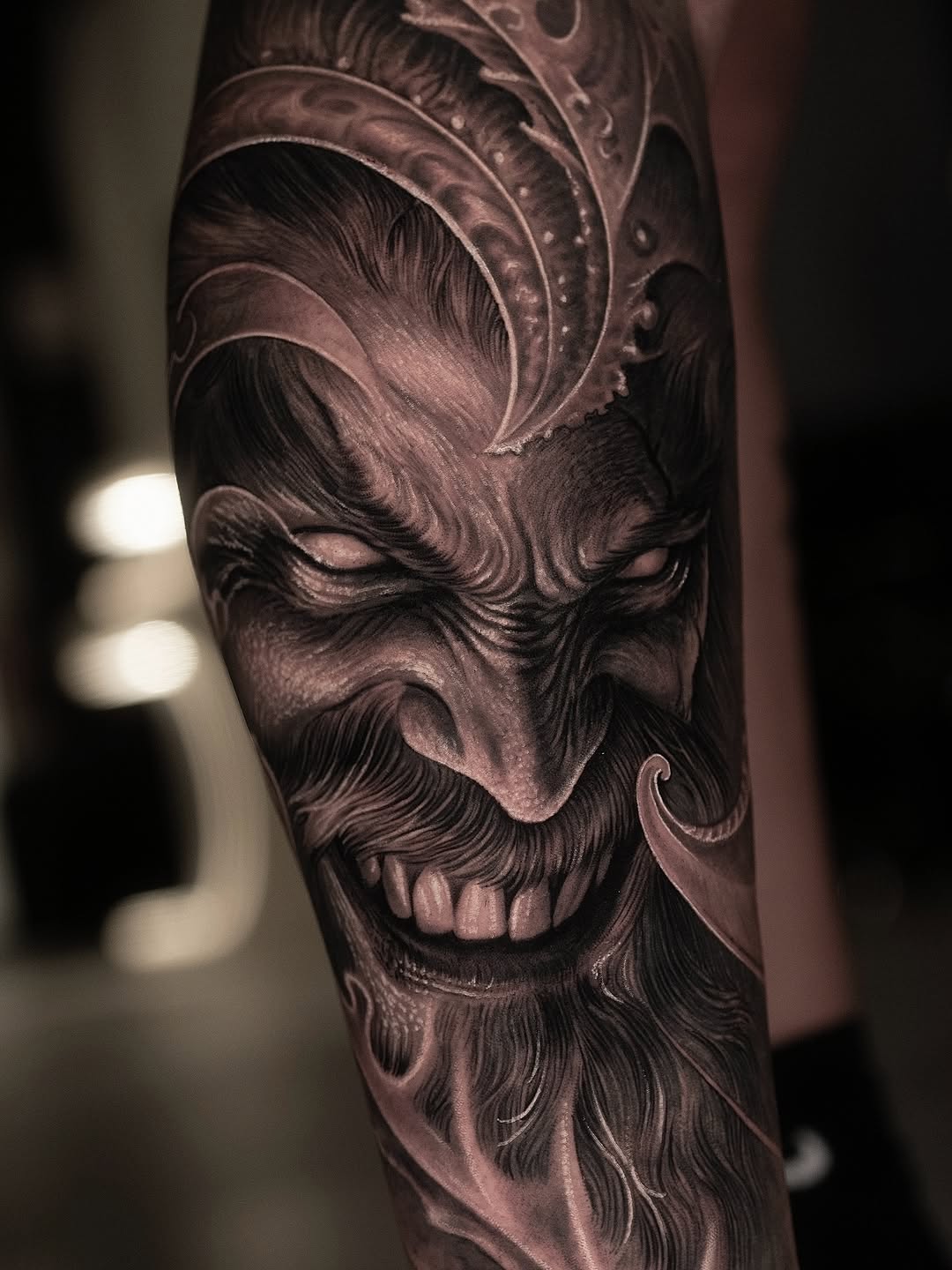 Demonic face realism tattoo on the forearm by @_garart_
