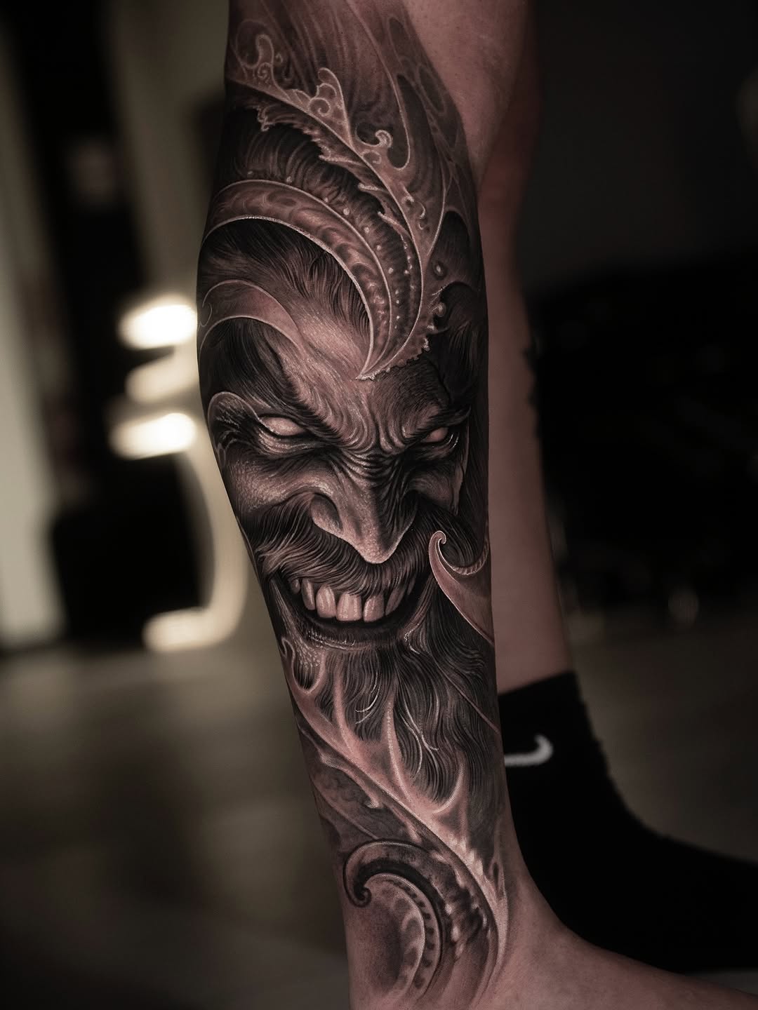 Demonic face realism tattoo on the forearm by @_garart_
