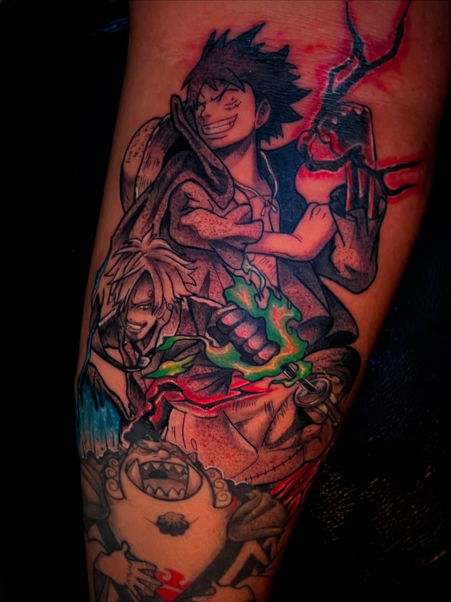 Anime characters anime tattoo on the forearm by Aiden Madrigal