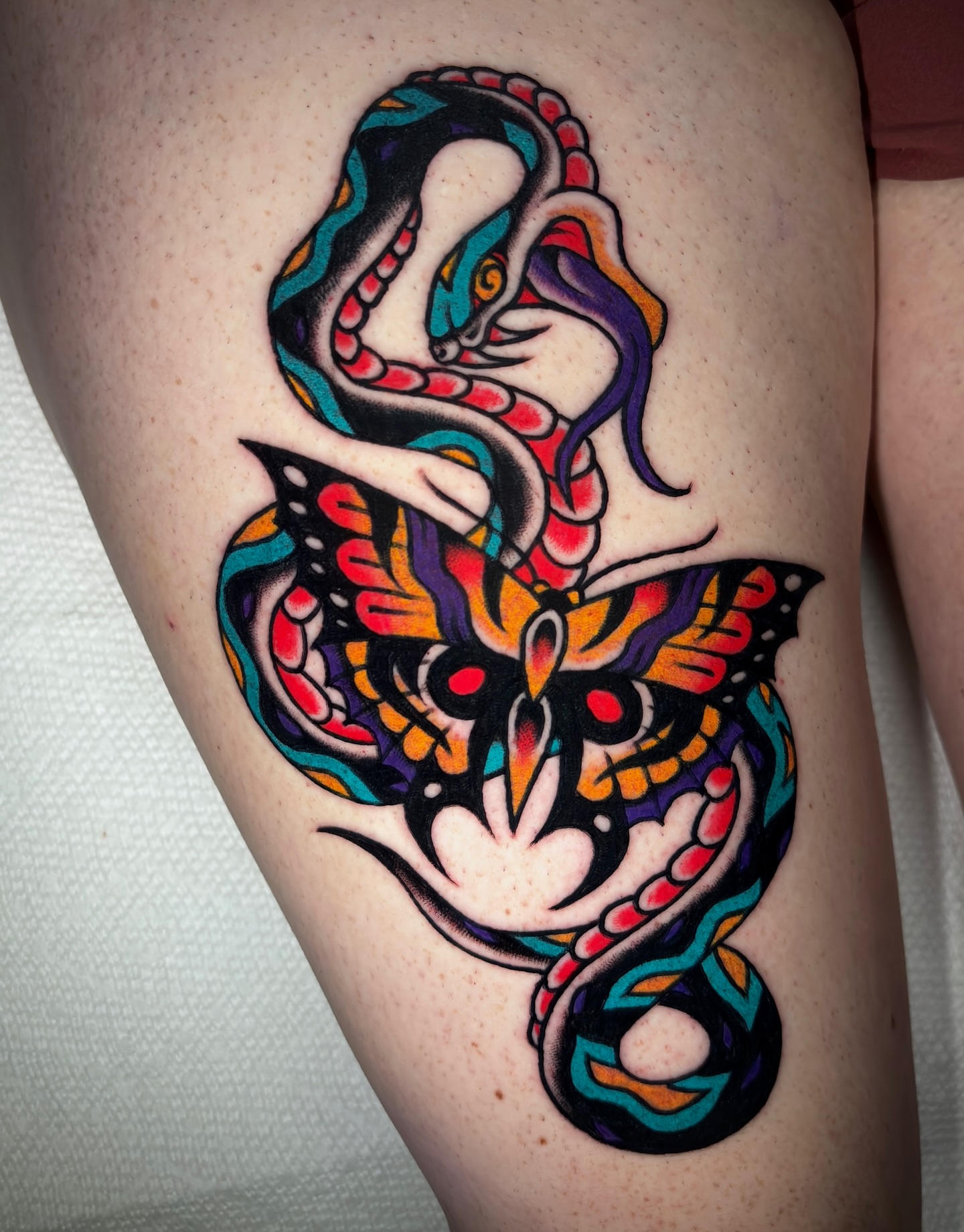 Snake American traditional tattoo on the thigh by Matt Elliott, Murfreesboro, Tennessee
