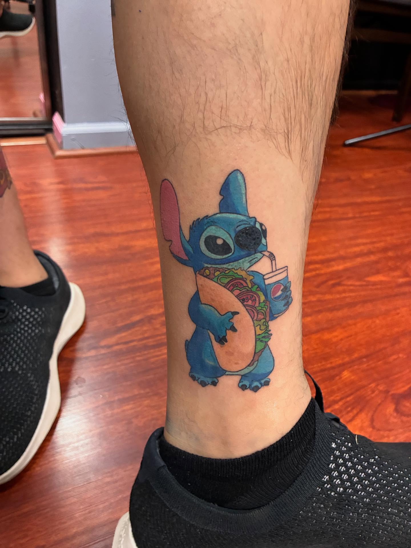 Stitch anime tattoo on the calf by Kat π