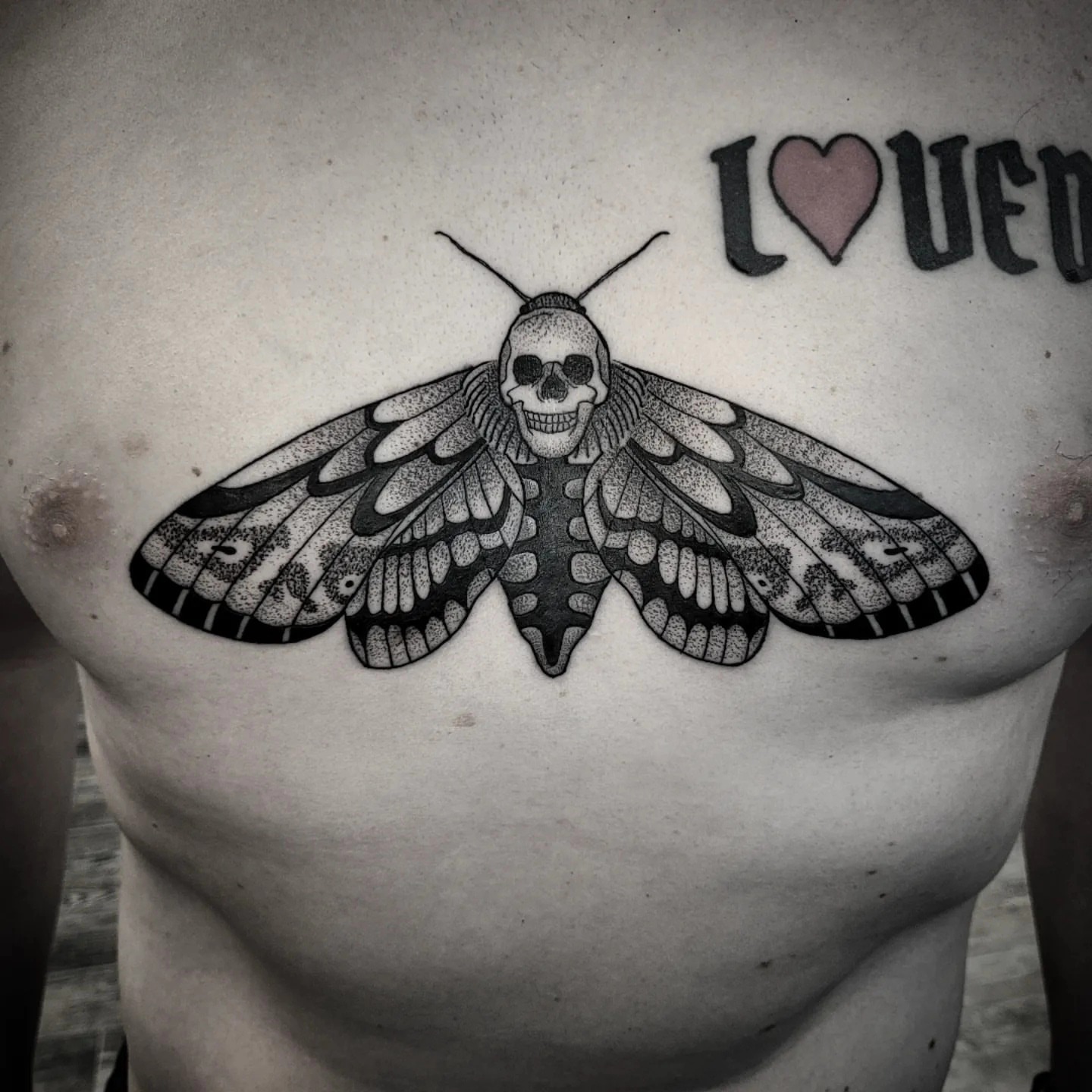 Death's-head moth dotwork tattoo on the chest by Kirk George