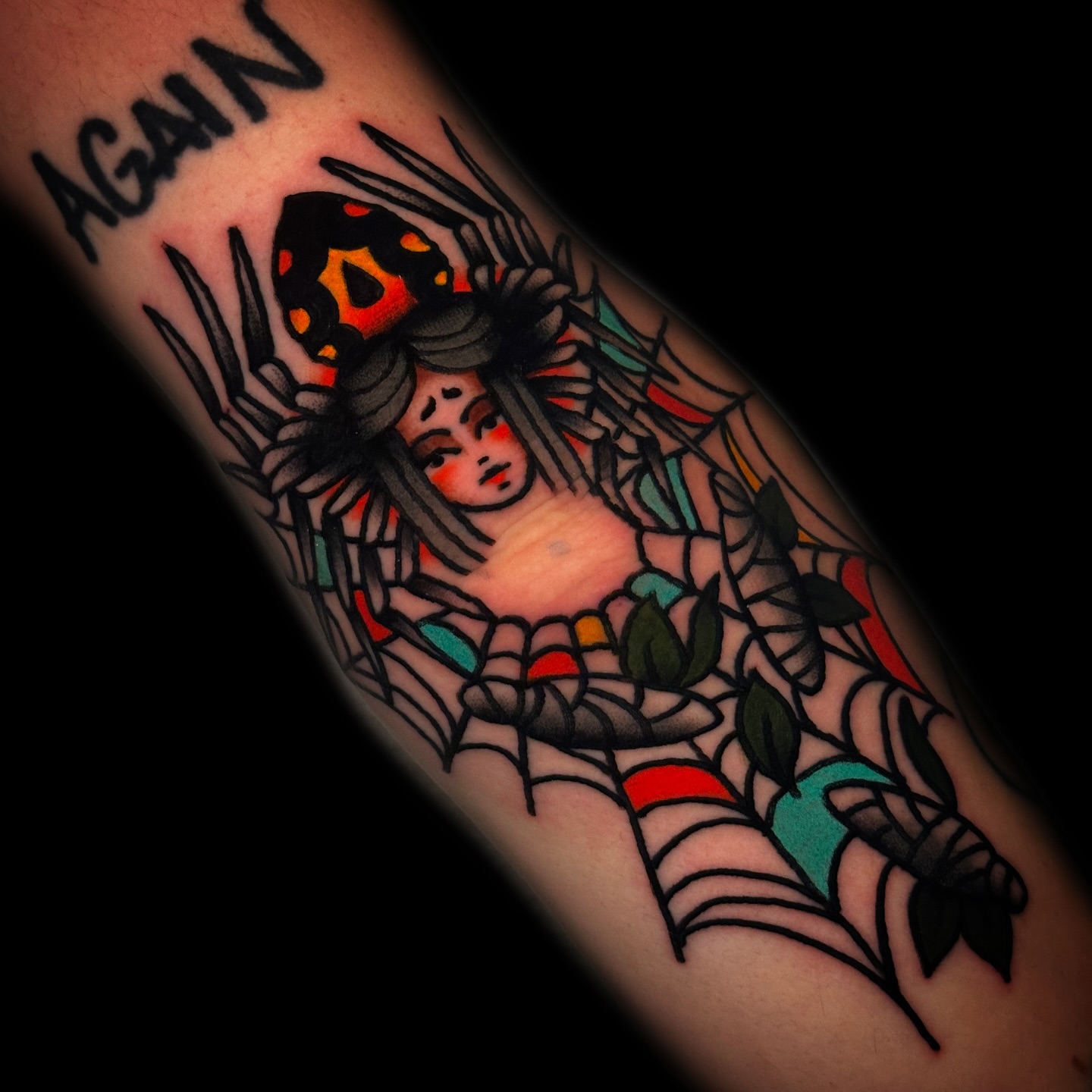 Woman entangled in spider web American traditional tattoo on the forearm by Danny Reis
