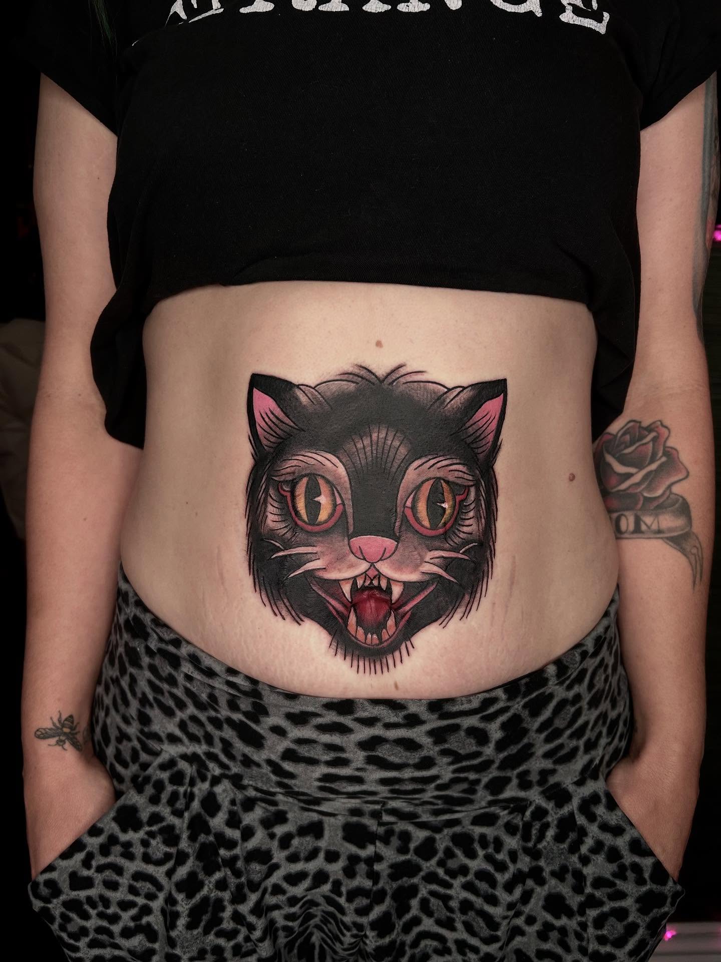 Cat American traditional tattoo on the torso by Jelly