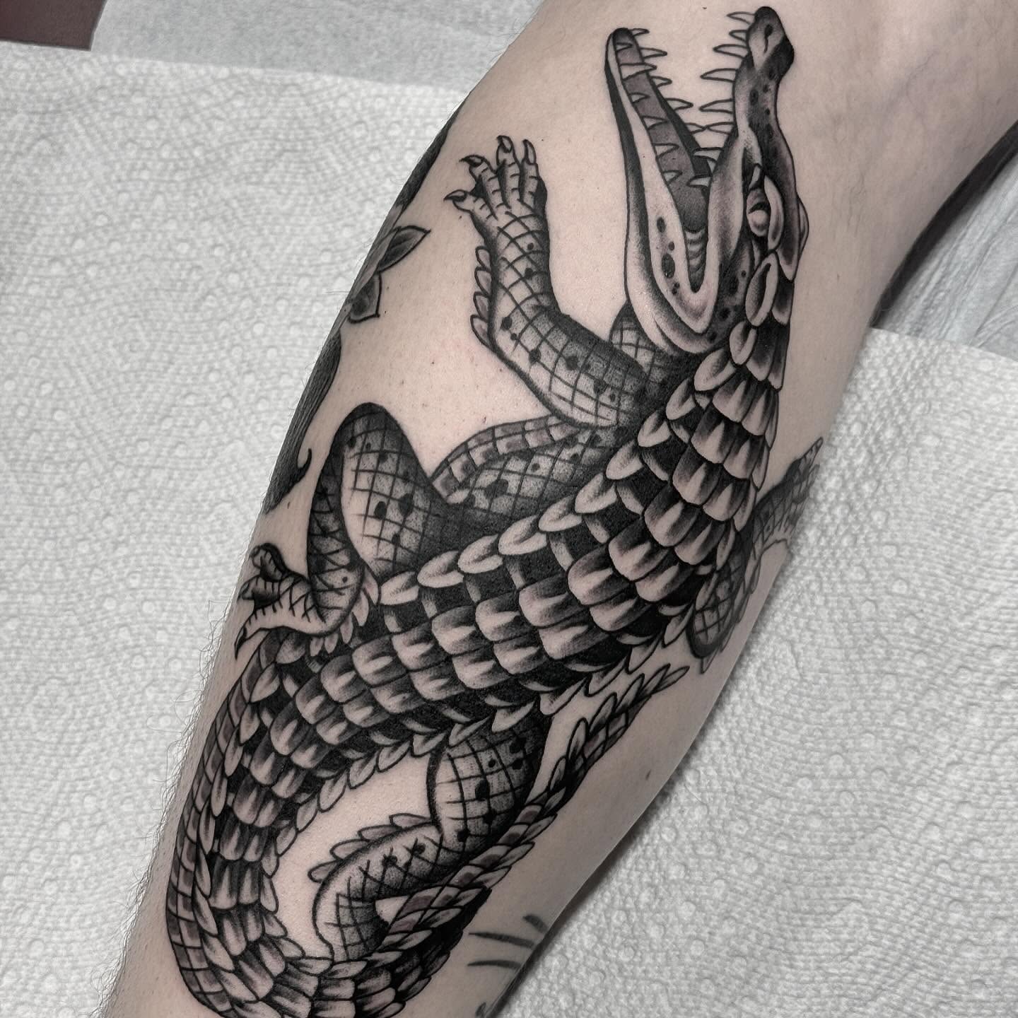 Alligator black and grey tattoo on the forearm by Sean McMahon
