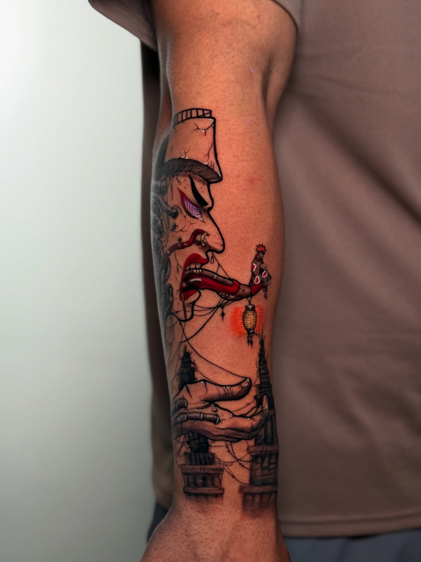Man smoking American traditional tattoo on the forearm by Iryna Polyakhova