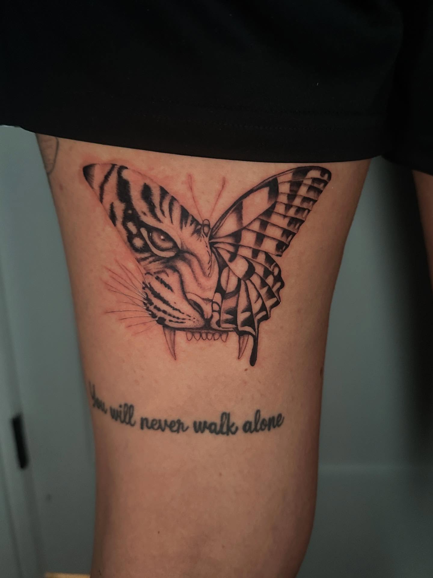 Tattoo by @nia.c__tattoo — black_and_grey, realism
