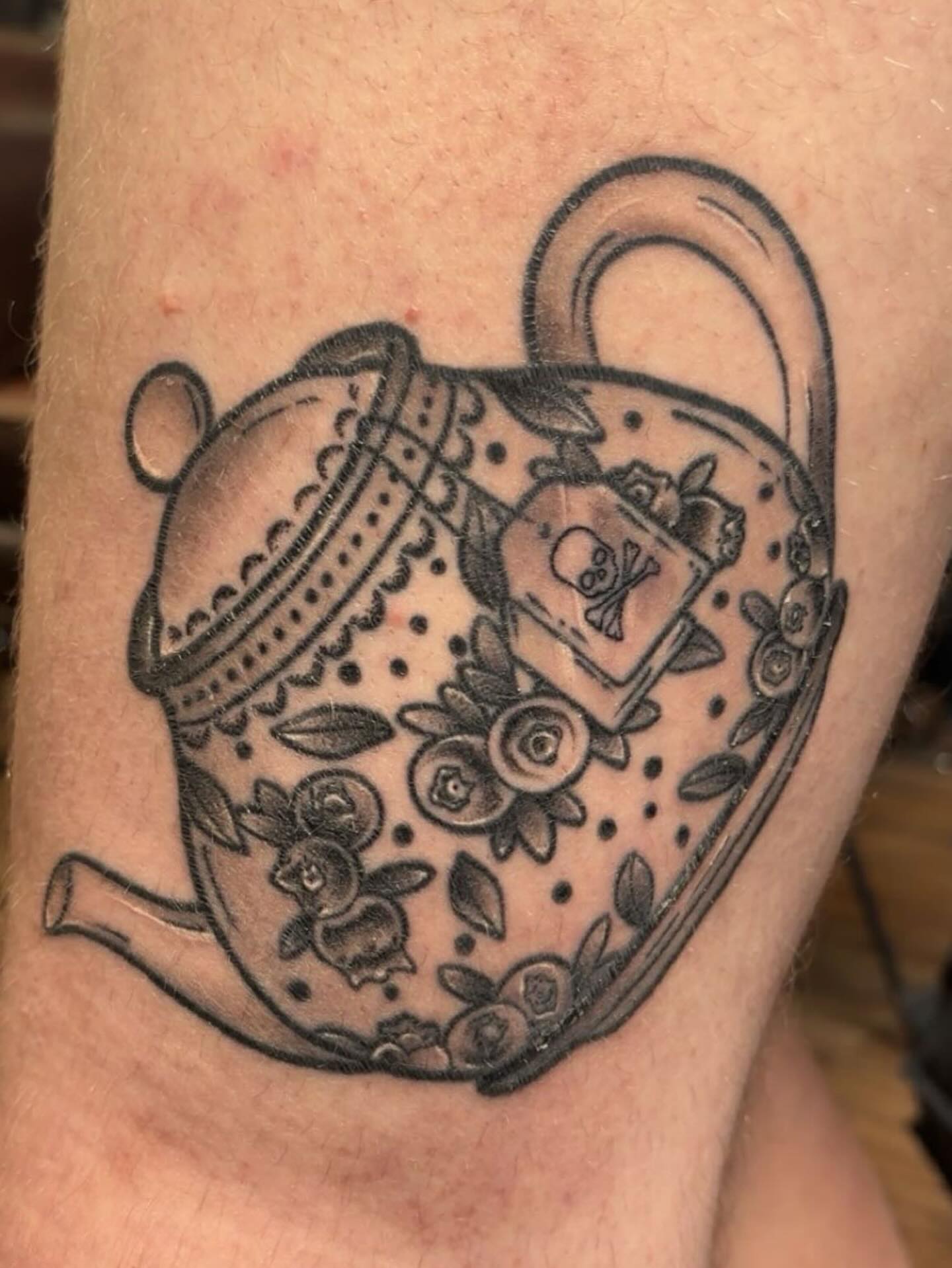 Teapot black and grey tattoo on the forearm by Molly Dixon