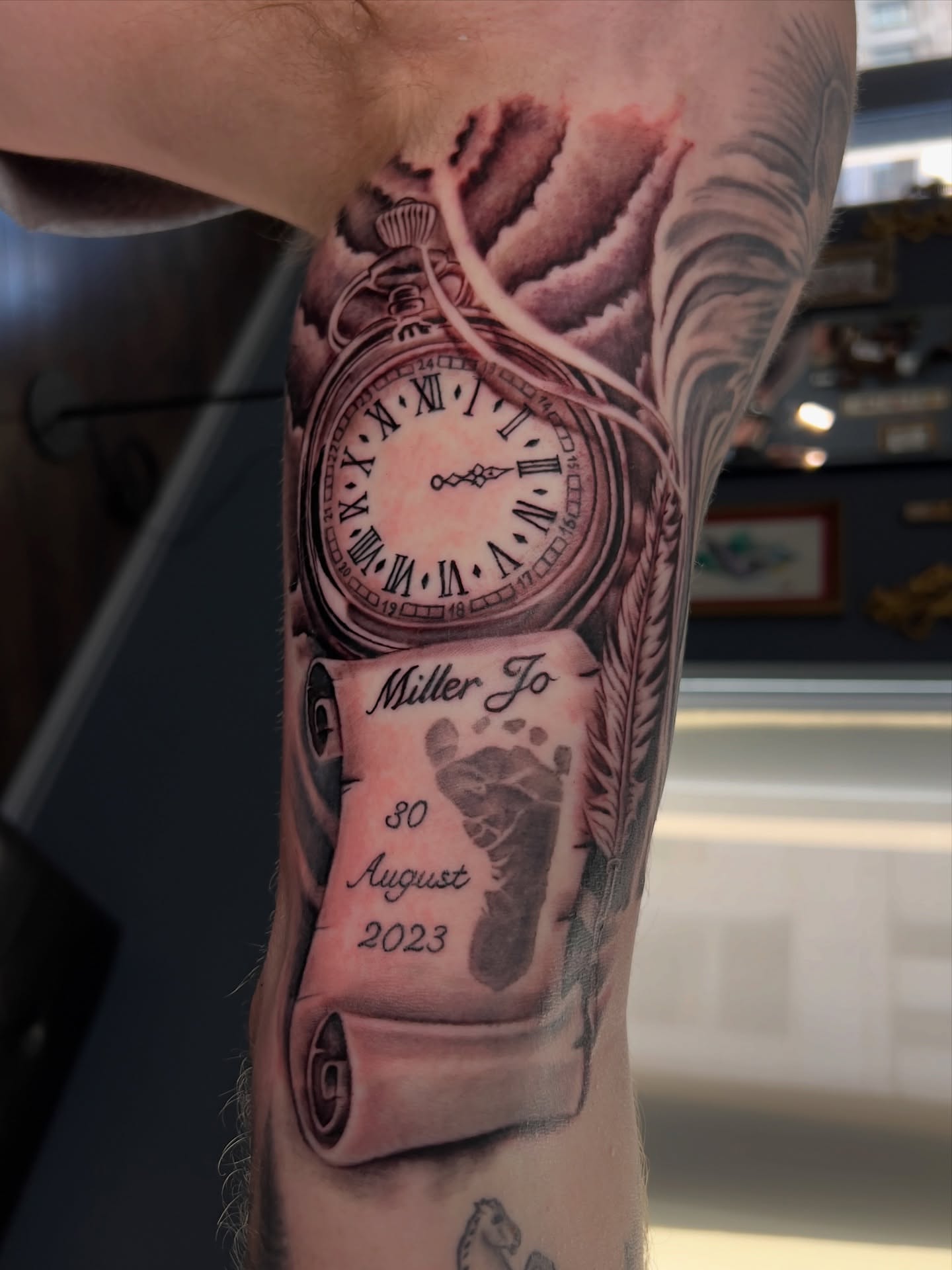 Pocket watch and footprint realism tattoo on the forearm by Ohio Realism Tattoo Artist