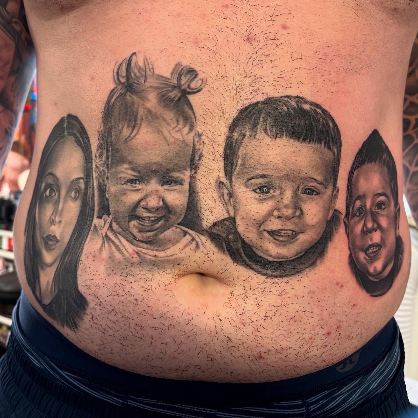 Family portrait realism tattoo on the torso by Mike Doherty, Abington, Massachusetts