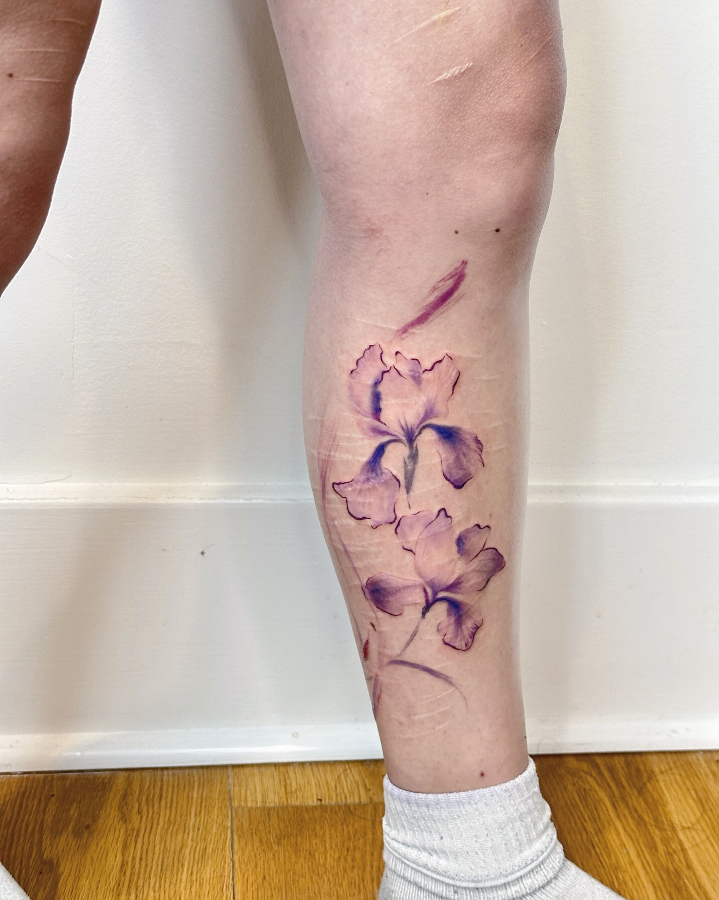 Iris flowers watercolor tattoo on the calf by Sylvia｜思岐, Vancouver, British Columbia
