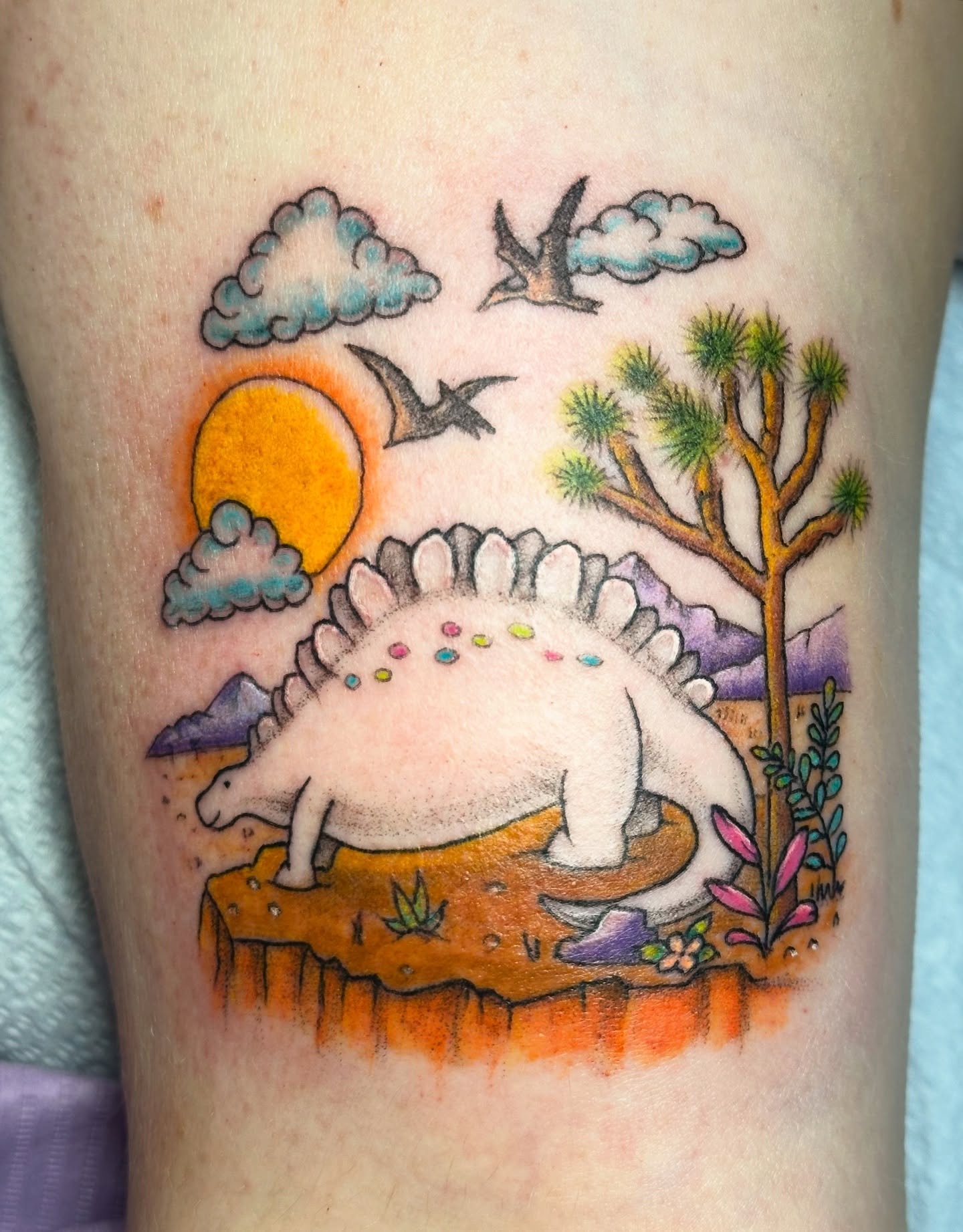 Stegosaurus dotwork tattoo on the thigh by Lauren DeLizza