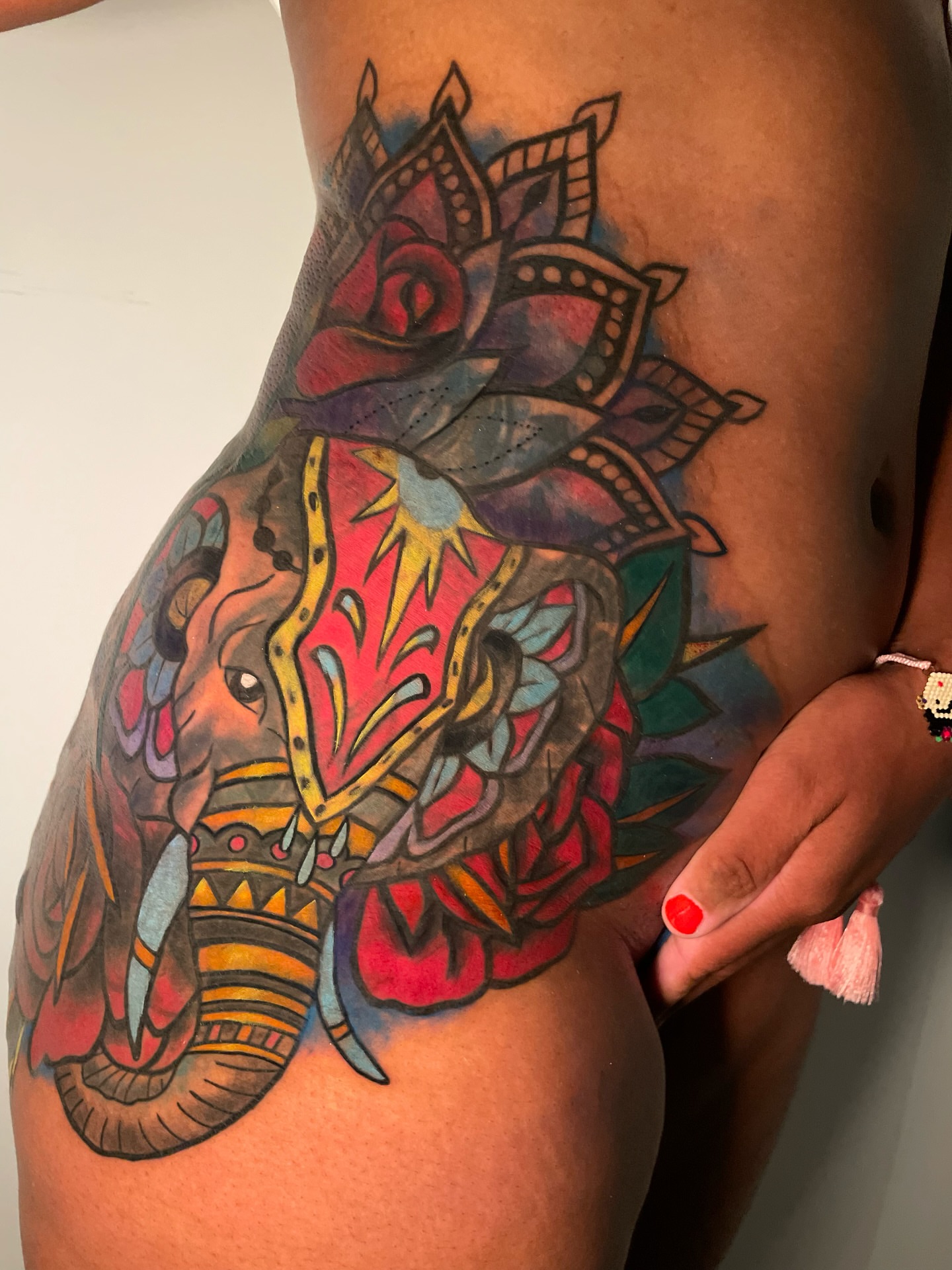 Elephant and floral new school tattoo on the thigh by Tattoo Artist