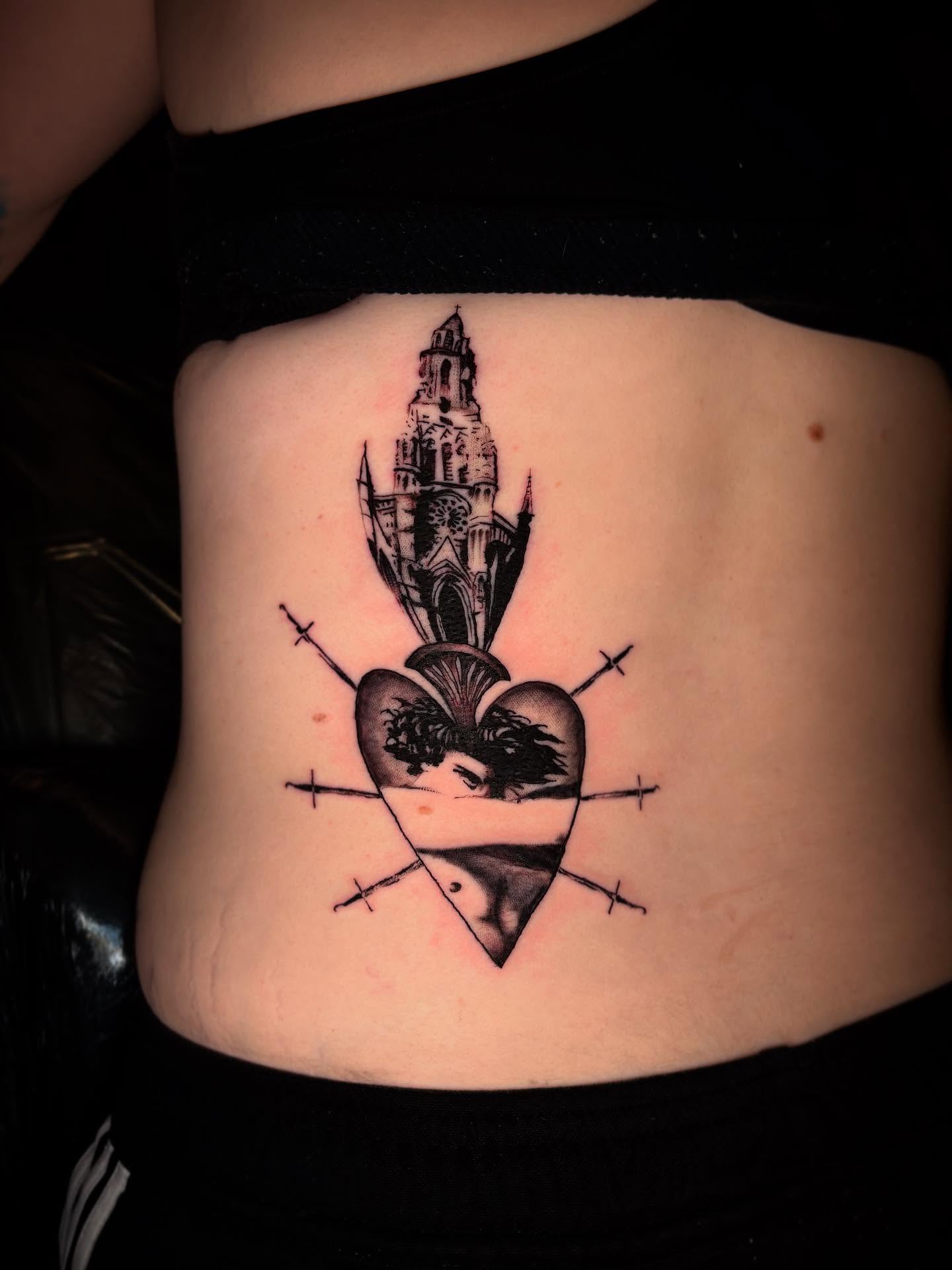 Heart with cathedral black and grey tattoo on the ribs by Haley Byers
