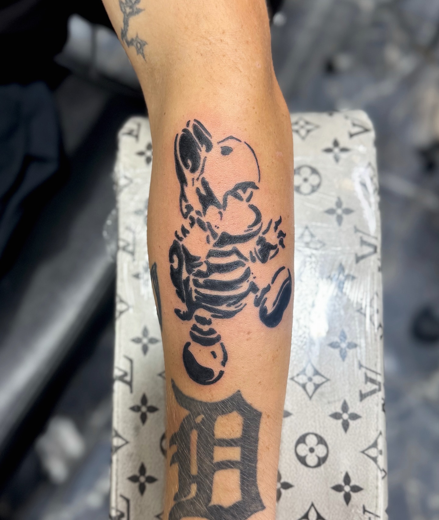 Skeleton black and grey tattoo on the forearm by Mango 🧿