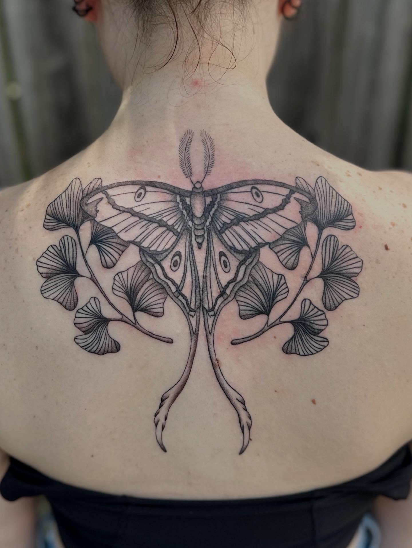 Moth and ginkgo leaves realism tattoo on the back by 🌼Kristen Kooster Tattoos🌼