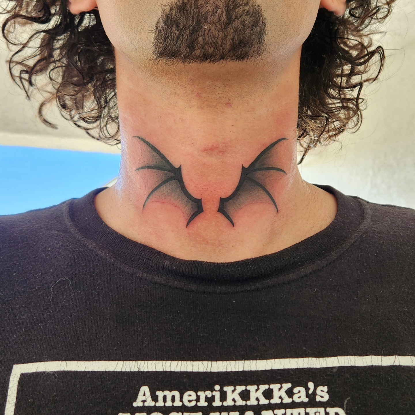 Bat wings black and grey tattoo on the neck by @youxg_guxxz