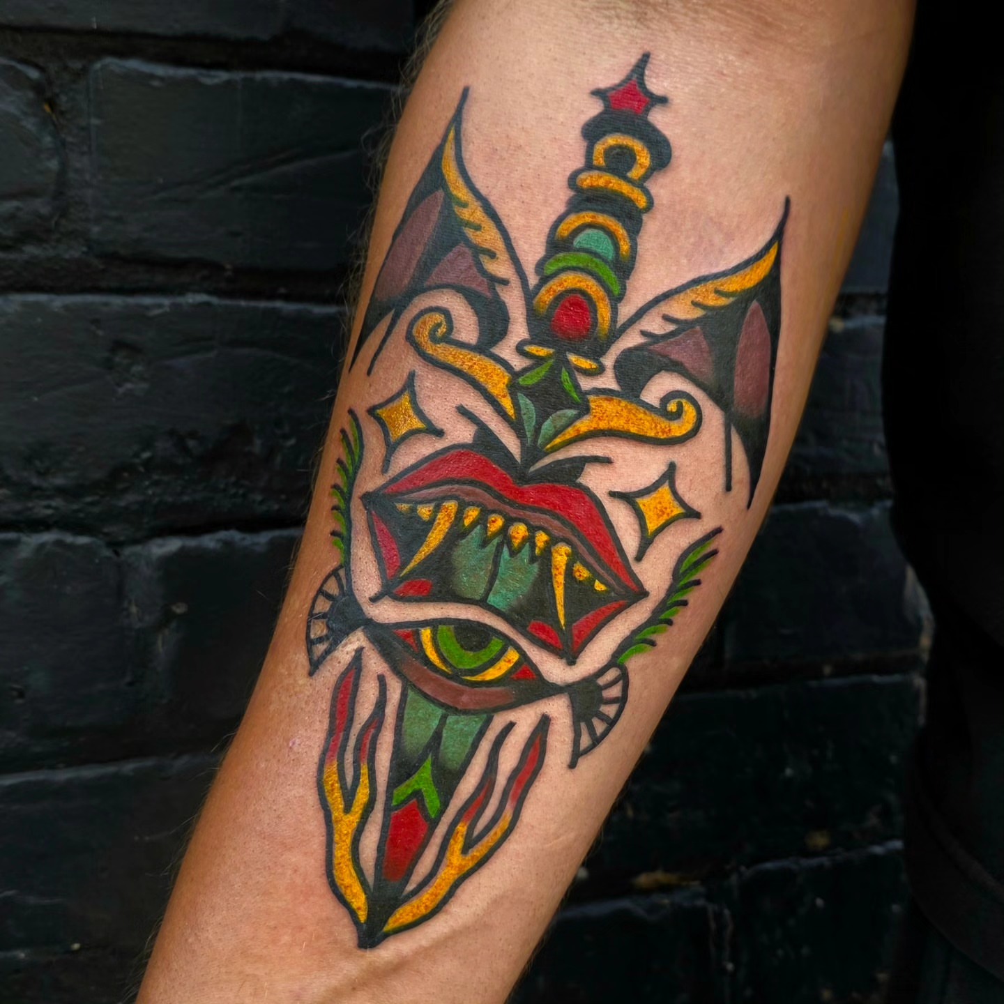 Eye with crown American traditional tattoo on the forearm by Mitch Braver