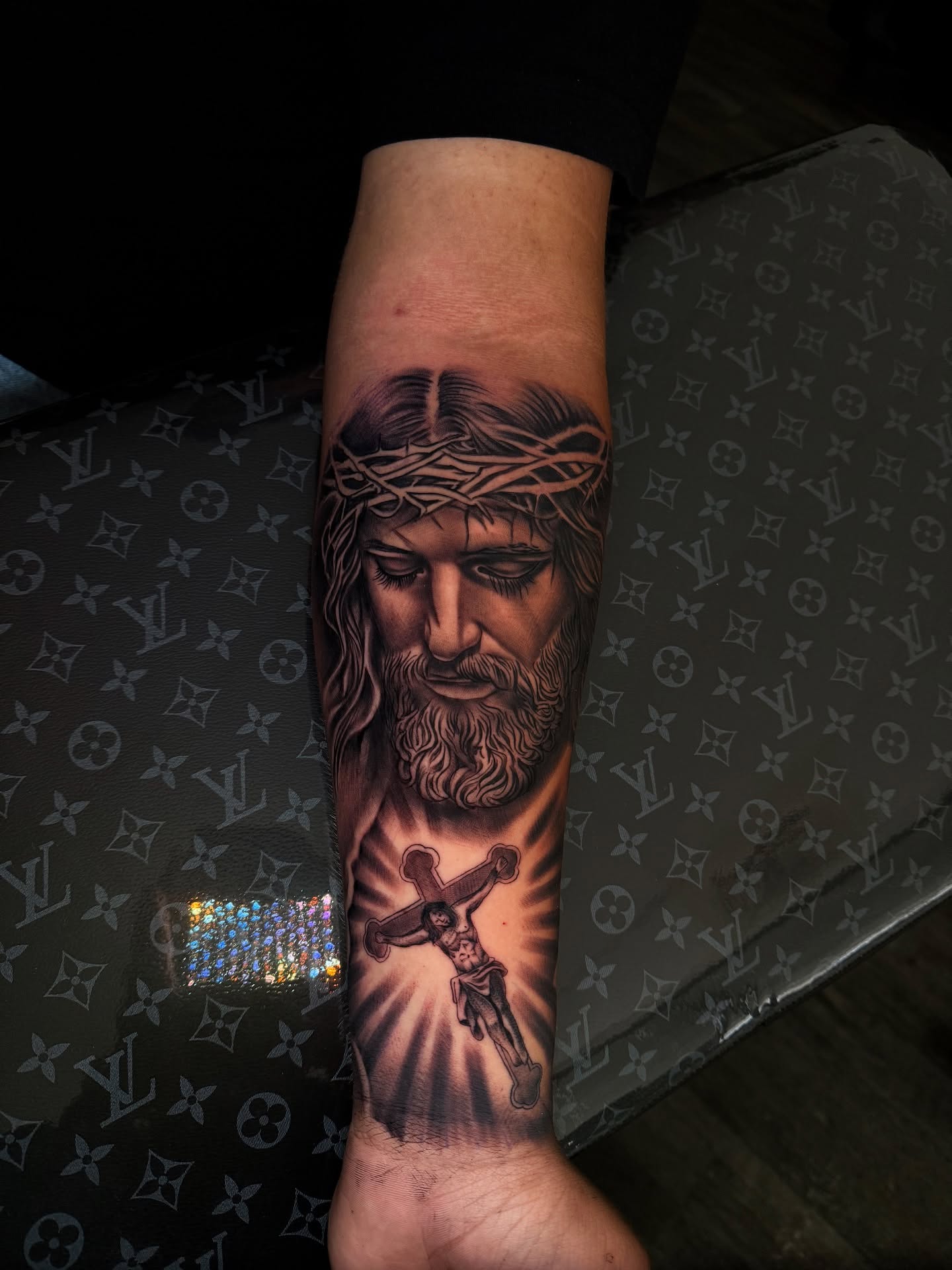 Jesus Christ realism tattoo on the forearm by Aaron Saenz jr