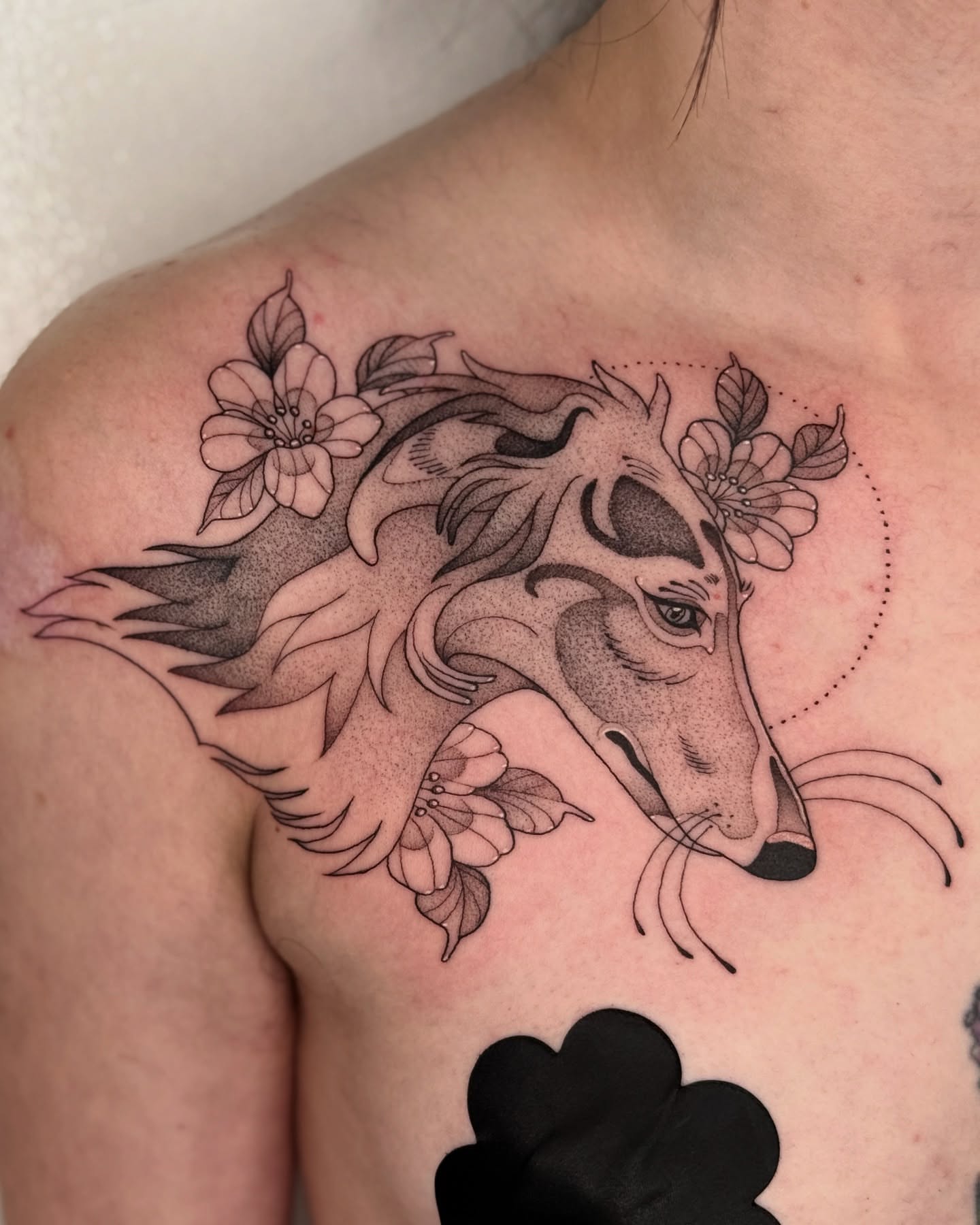 Wolf with flowers dotwork tattoo on the shoulder by Connor🍄🏳️‍⚧️