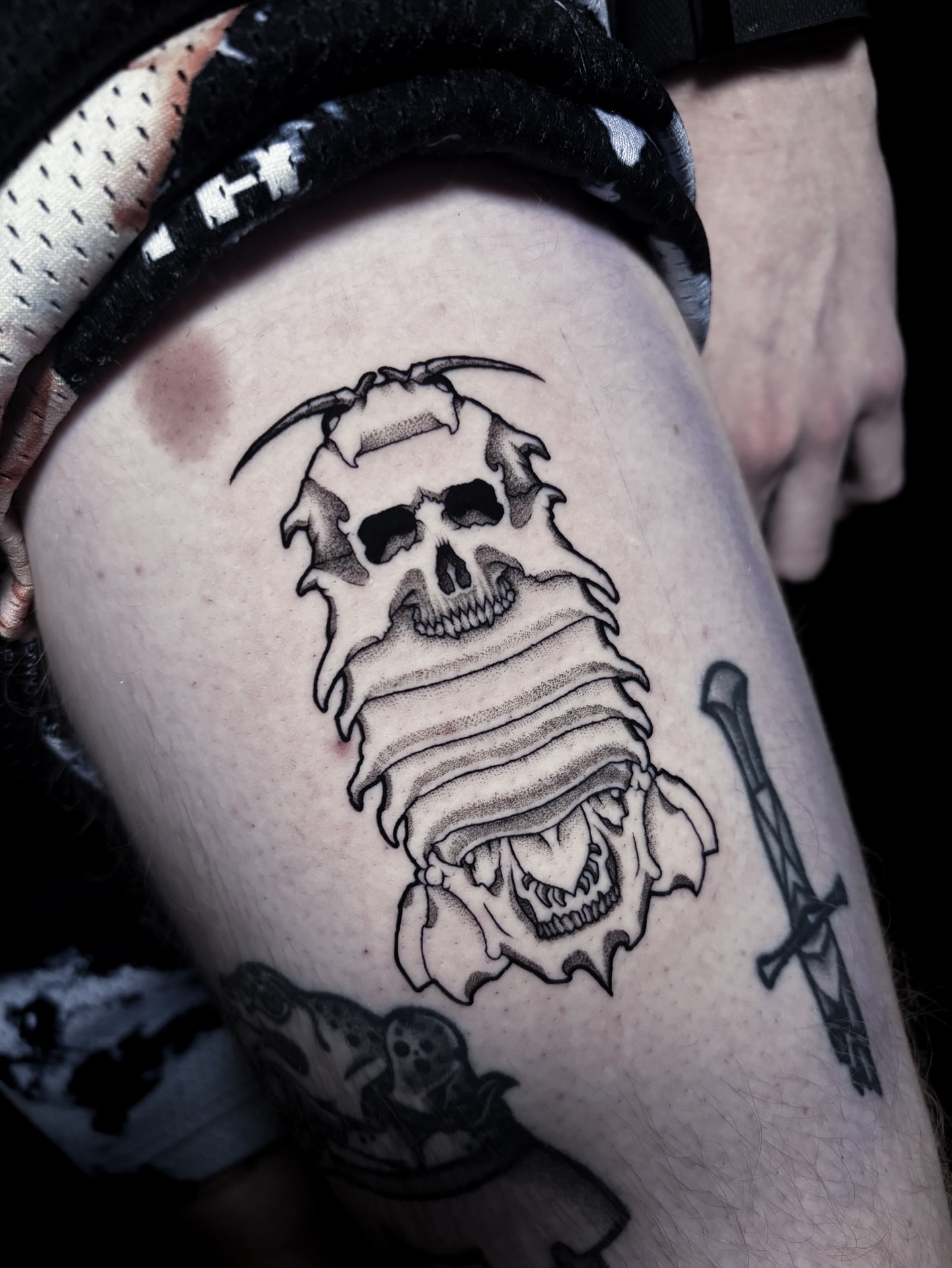 Skull and reaper black and grey tattoo on the thigh by Noah Dang Ink