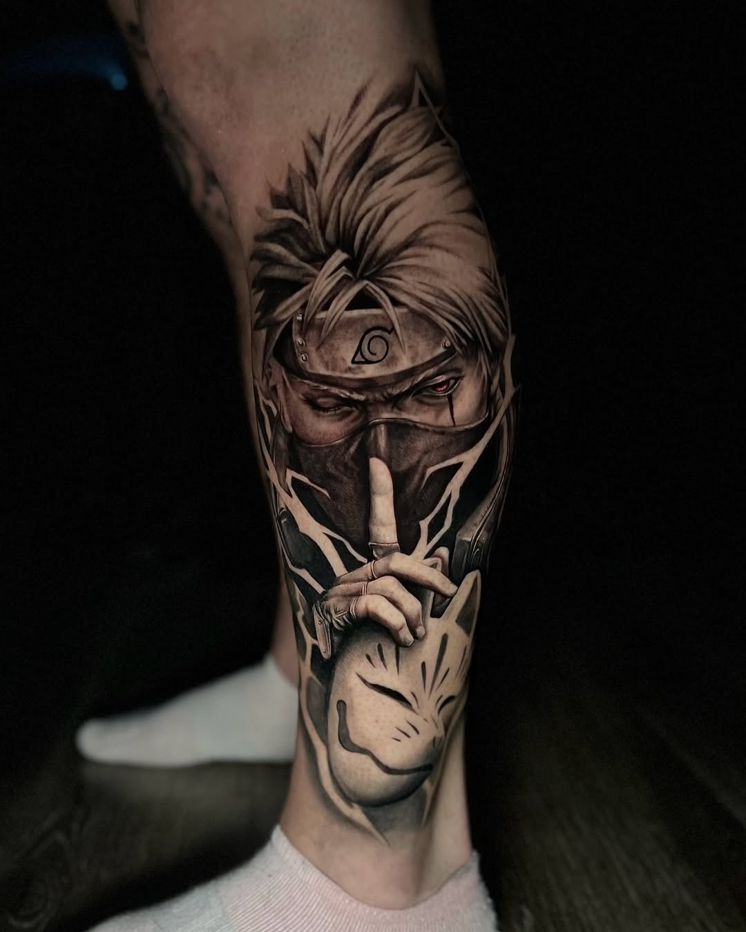 Kakashi Hatake with Kitsune mask anime tattoo on the forearm by Tommy Nguyen, Eastpointe, Michigan