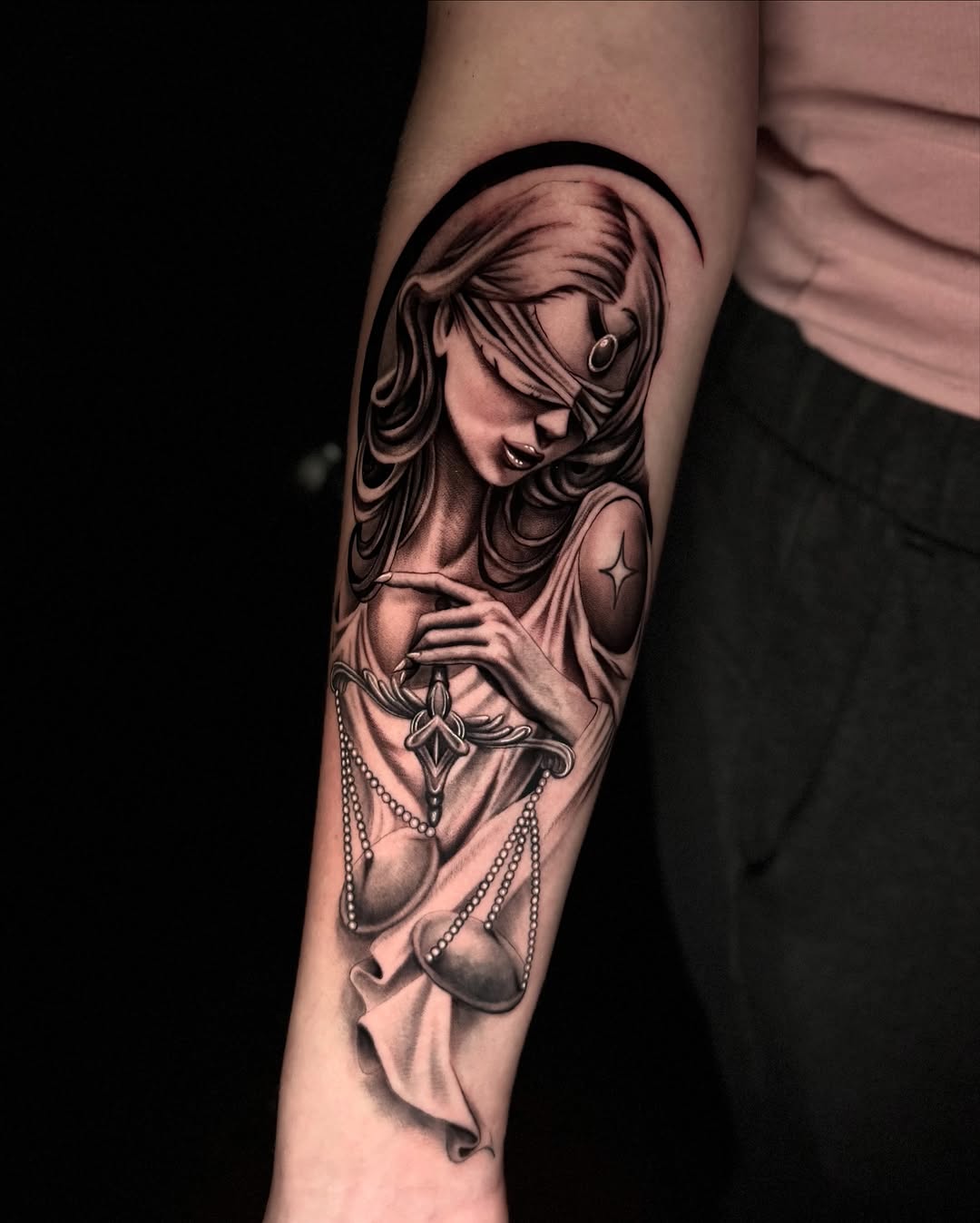Lady Justice with scales realism tattoo on the forearm by Tommy Nguyen, Eastpointe, Michigan