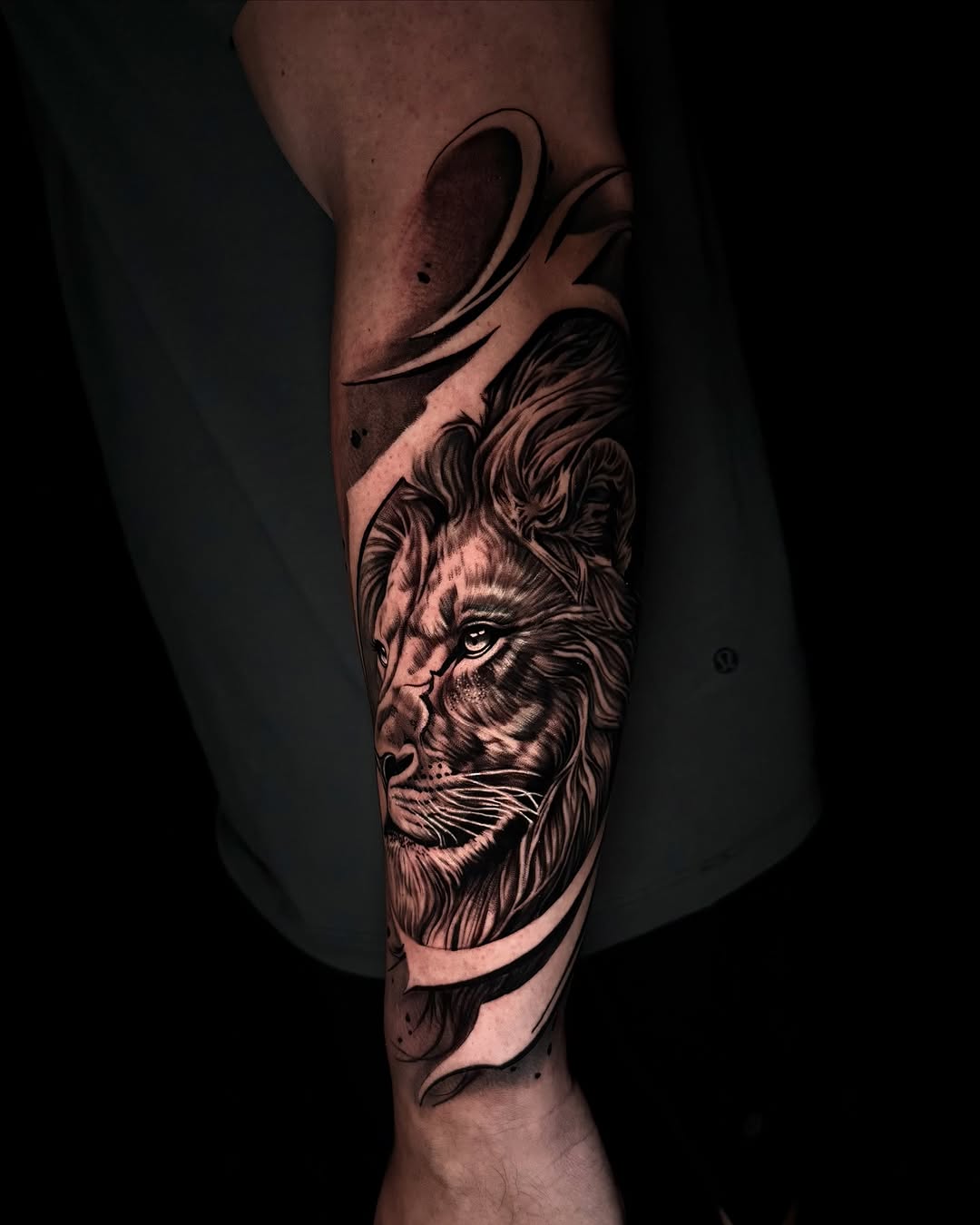Lion portrait realism tattoo on the forearm by Tommy Nguyen, Eastpointe, Michigan