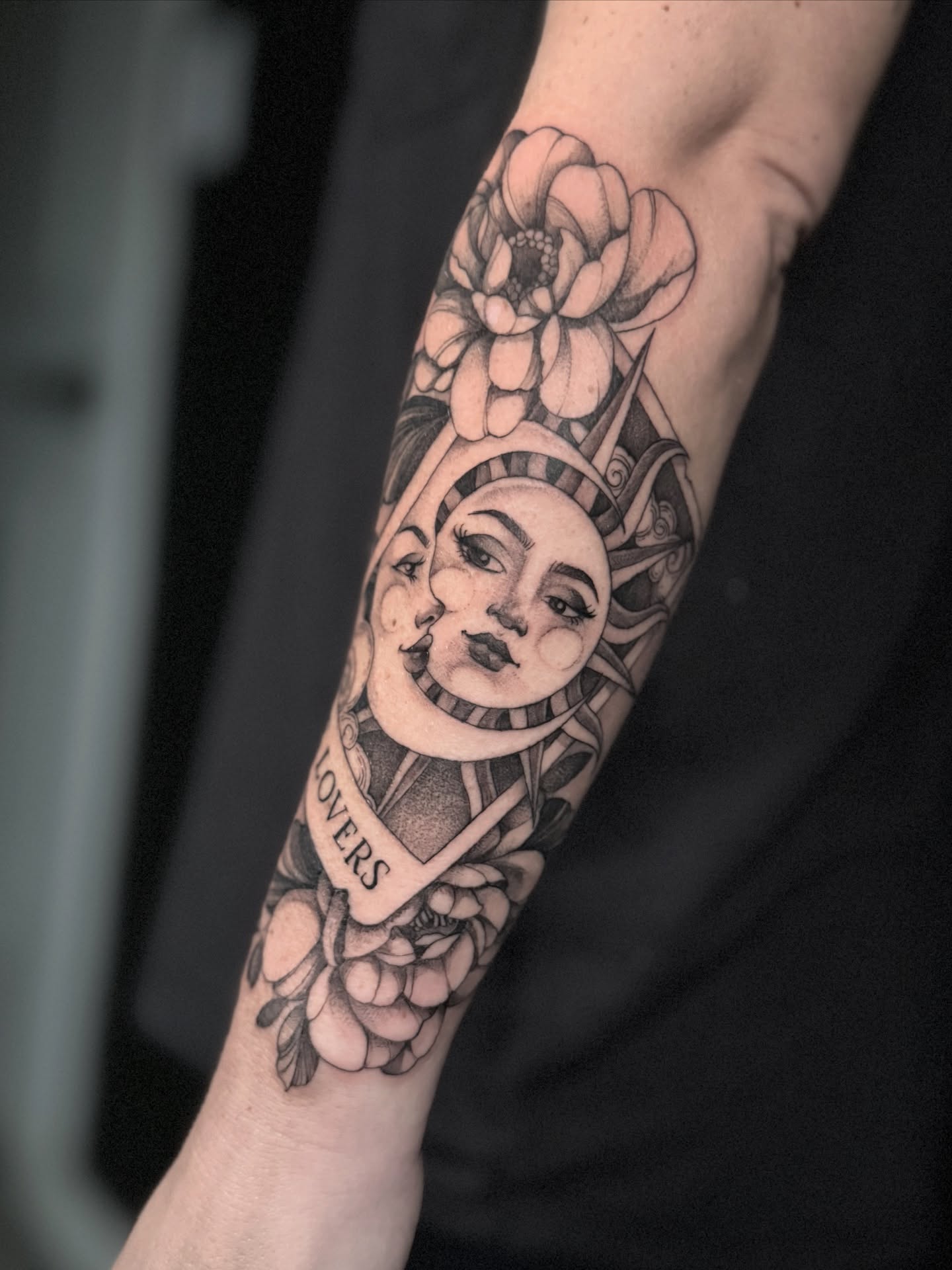 Sun and moon realism tattoo on the forearm by Chelsea Speirs
