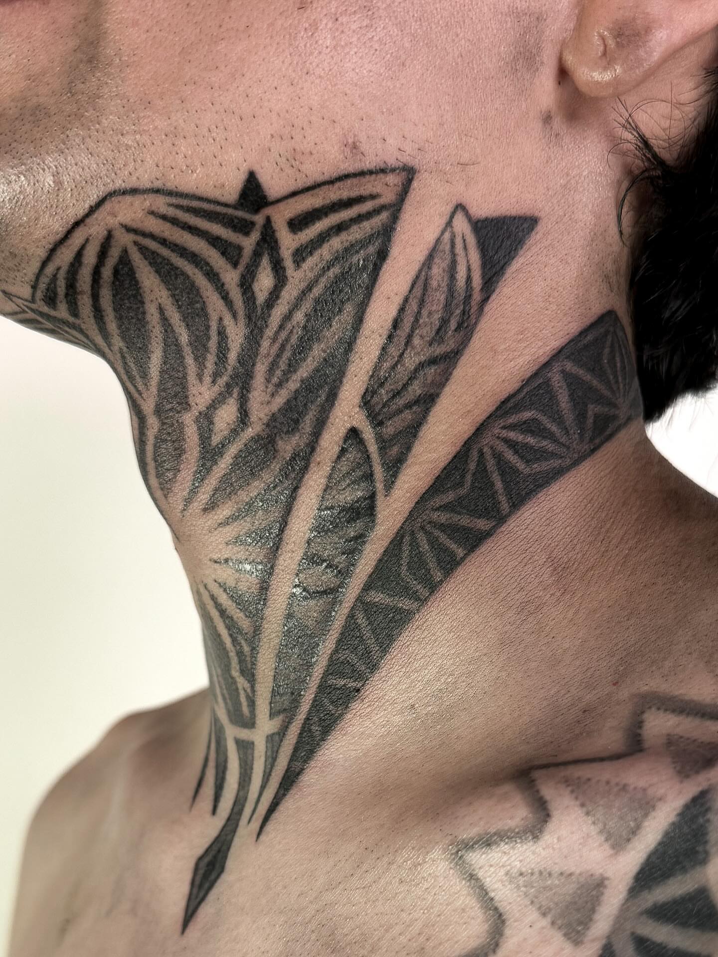 Geometric pattern geometric tattoo on the neck by Jamie Beach, Wheat Ridge, Colorado