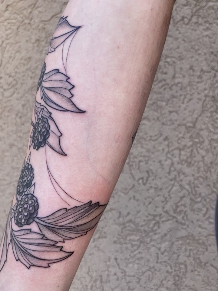 Flowers black and grey tattoo on the forearm by Stevie Timmreck, Utica, Michigan