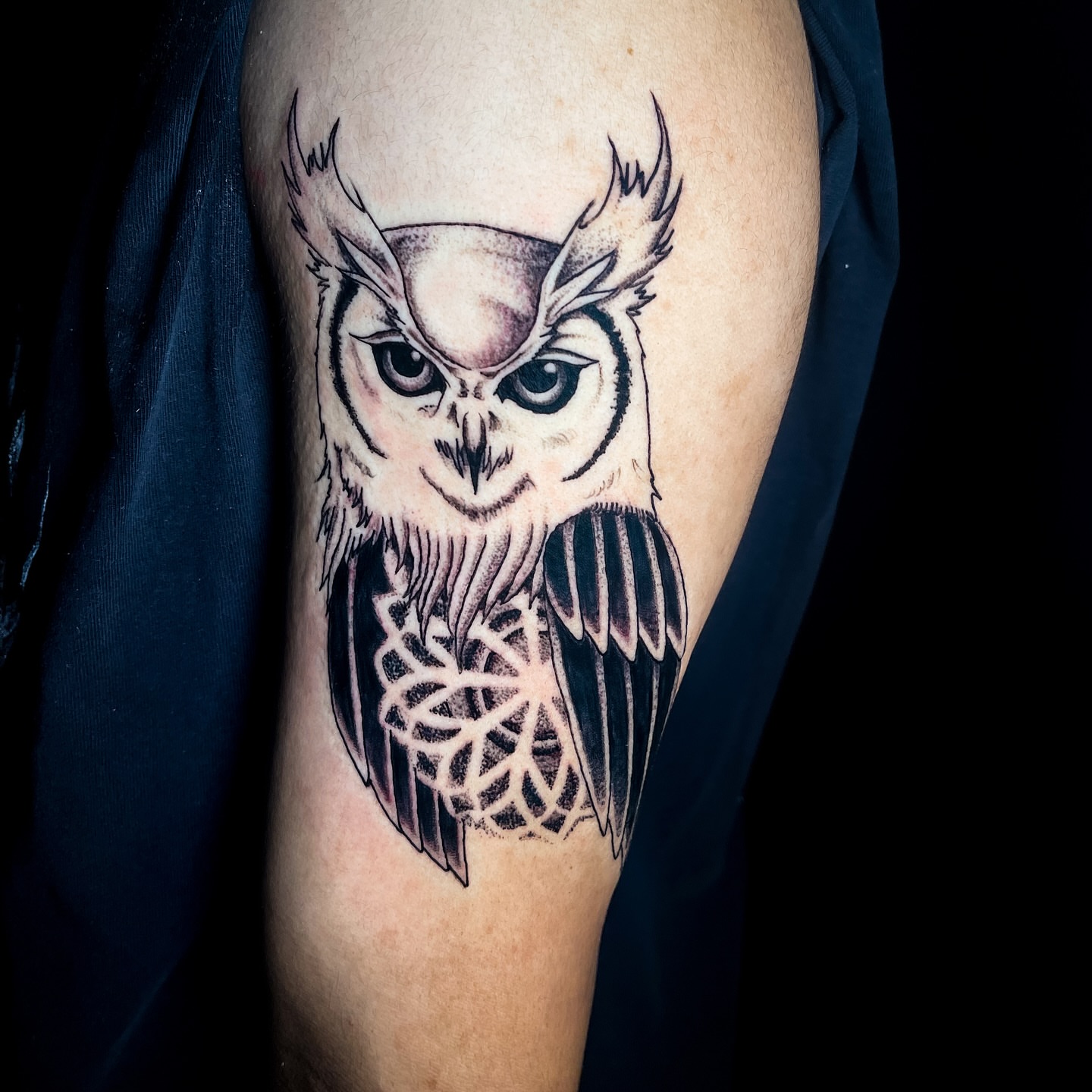 Owl black and grey tattoo on the forearm by Miguel Henrik