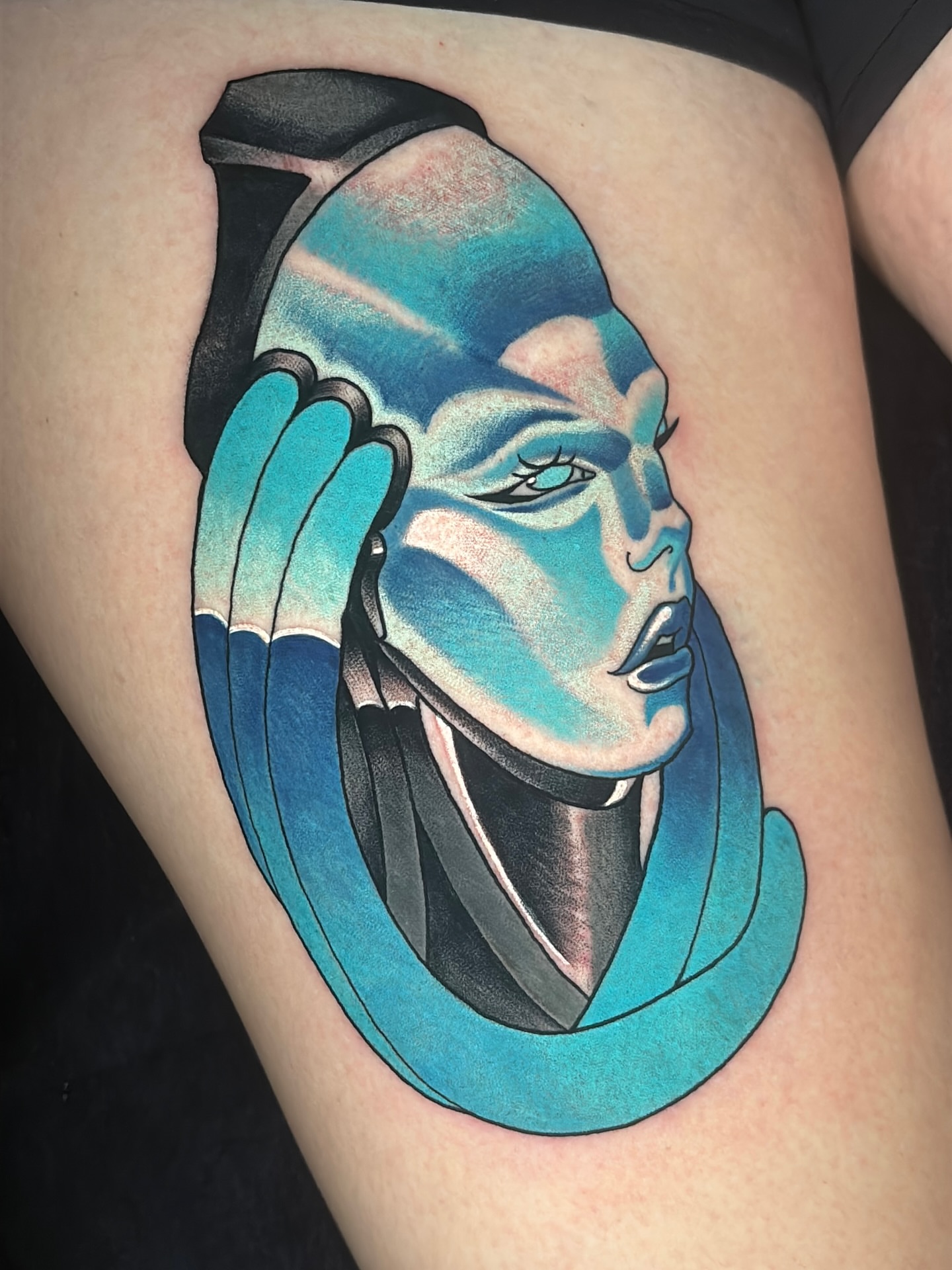 Avatar geometric tattoo on the thigh by Latesha Burnley