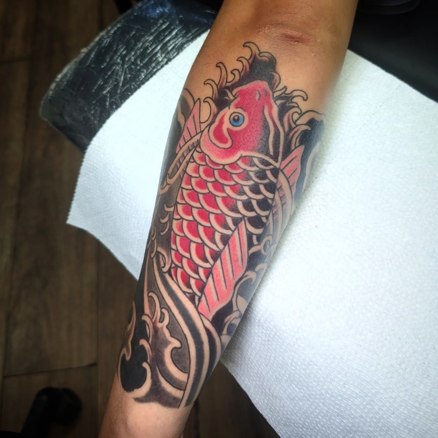 Koi fish American traditional tattoo on the forearm by joseph palladino