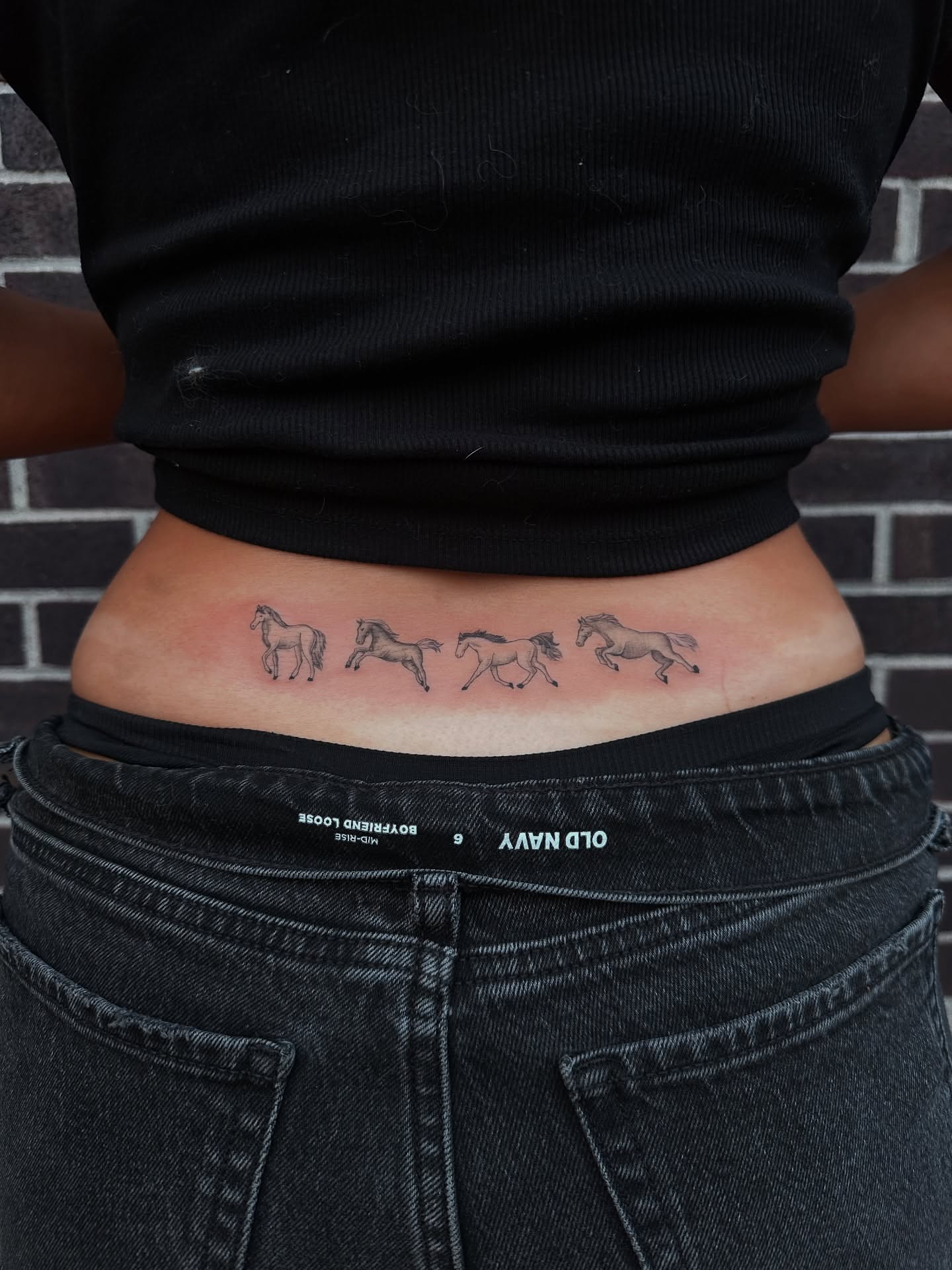 Horses black and grey tattoo on the ribs by Hail Chaney, Somerville, Massachusetts