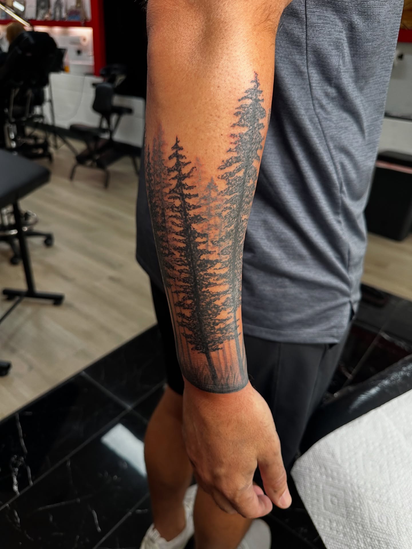 Forest black and grey tattoo on the forearm by Jinx Ryder