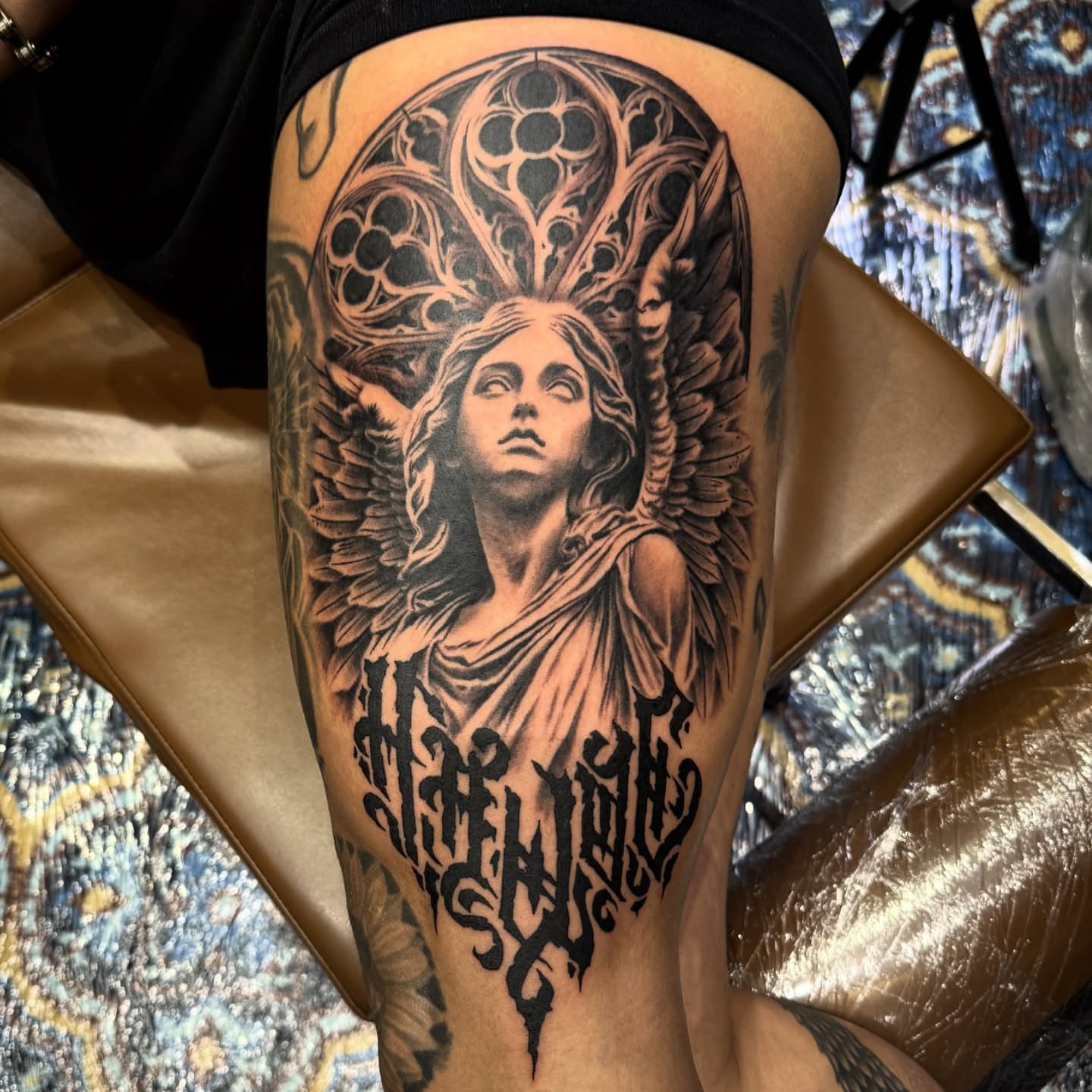 Angel realism tattoo on the thigh by Zack Havoc