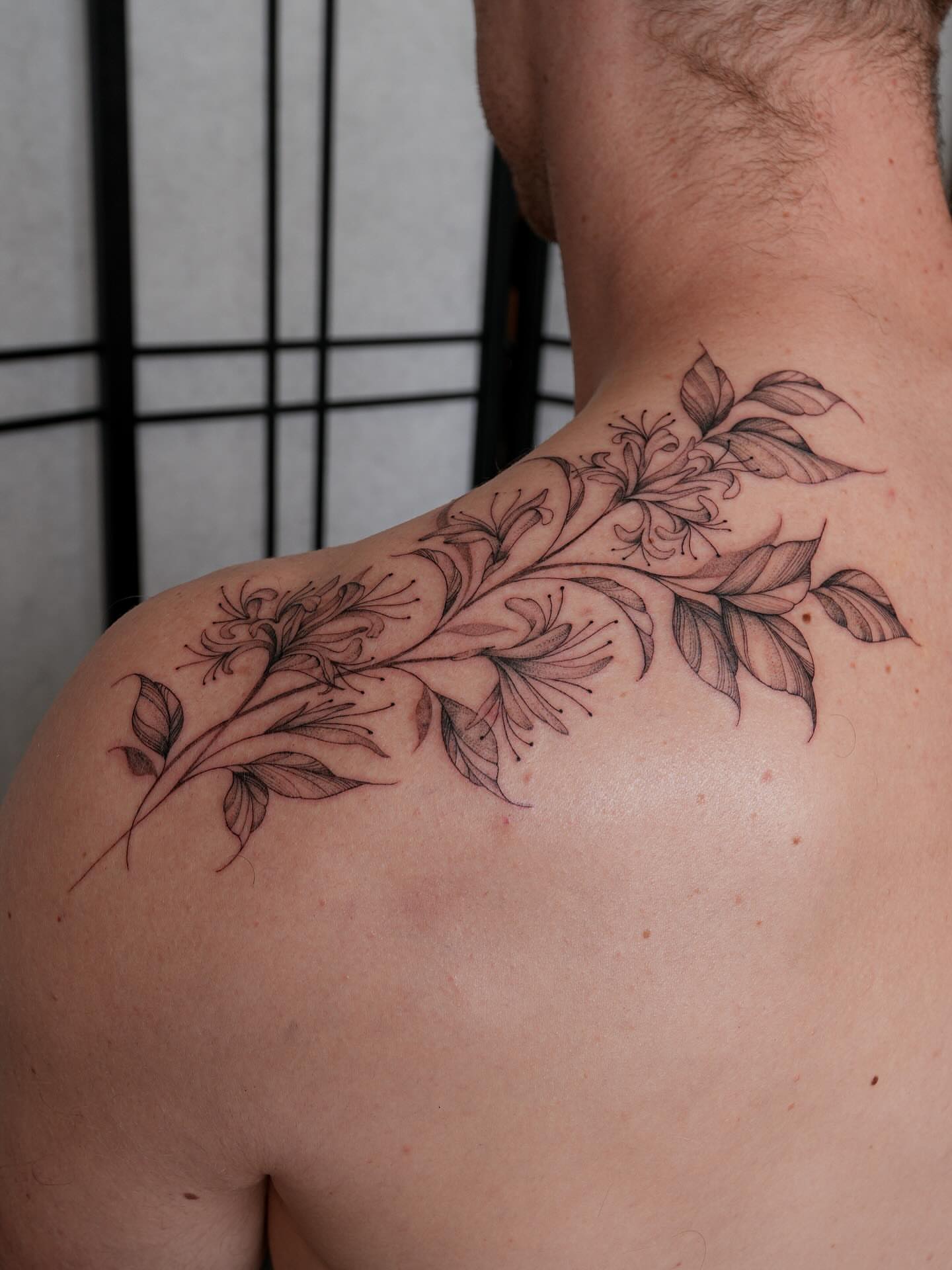Flower branch black and grey tattoo on the shoulder by Pandora ✨ Floral, Los Angeles, California