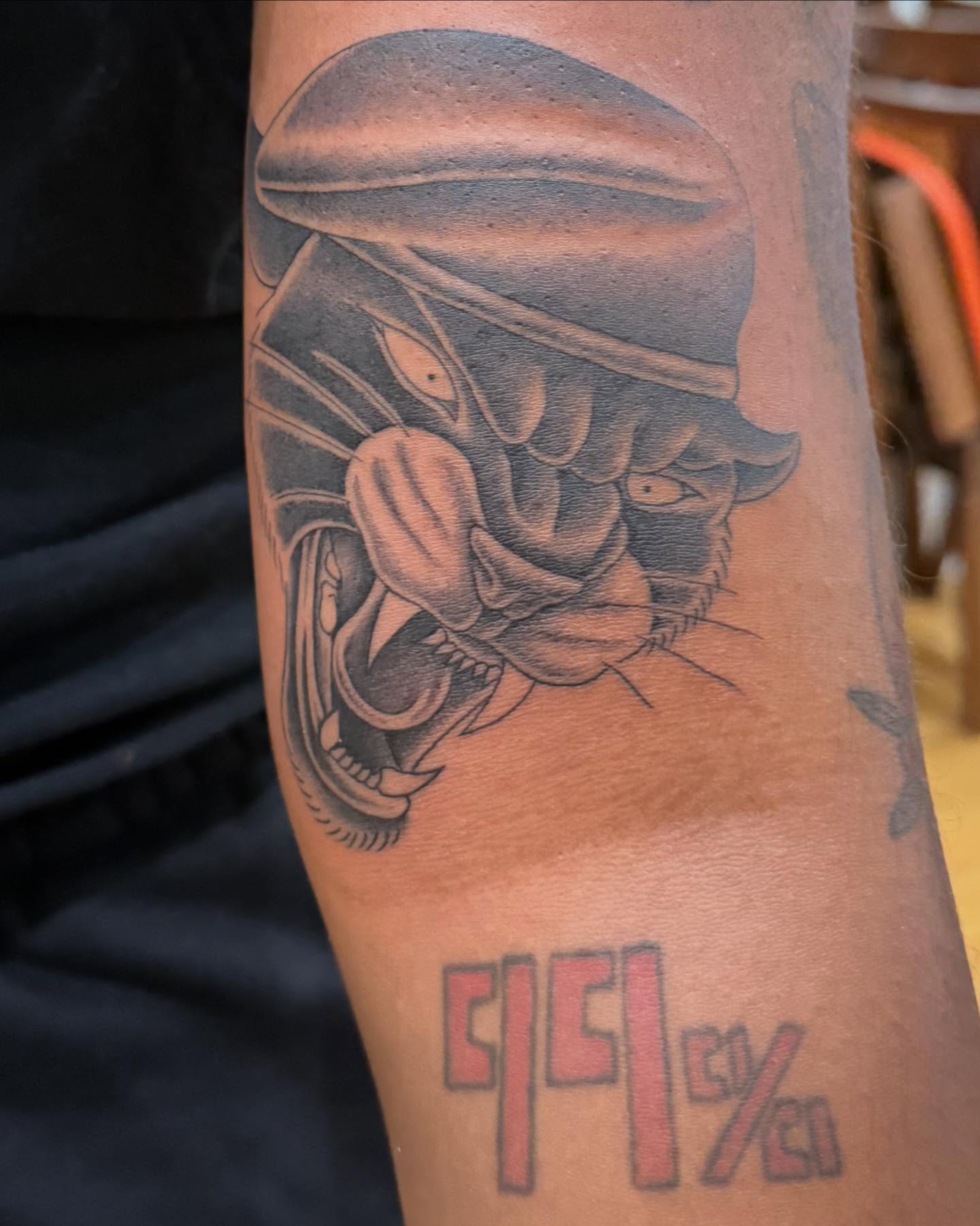 Tiger helmet black and grey tattoo on the forearm by 𝕯𝖗𝖆𝕶𝖊㋛