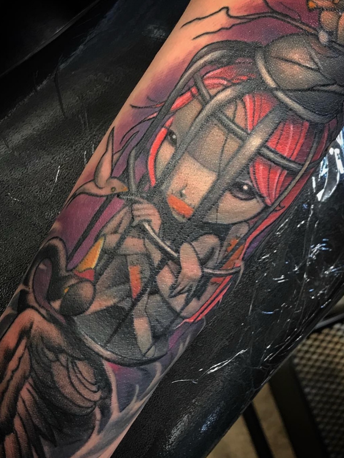 Anime character anime tattoo on the forearm by Amanda Leitch