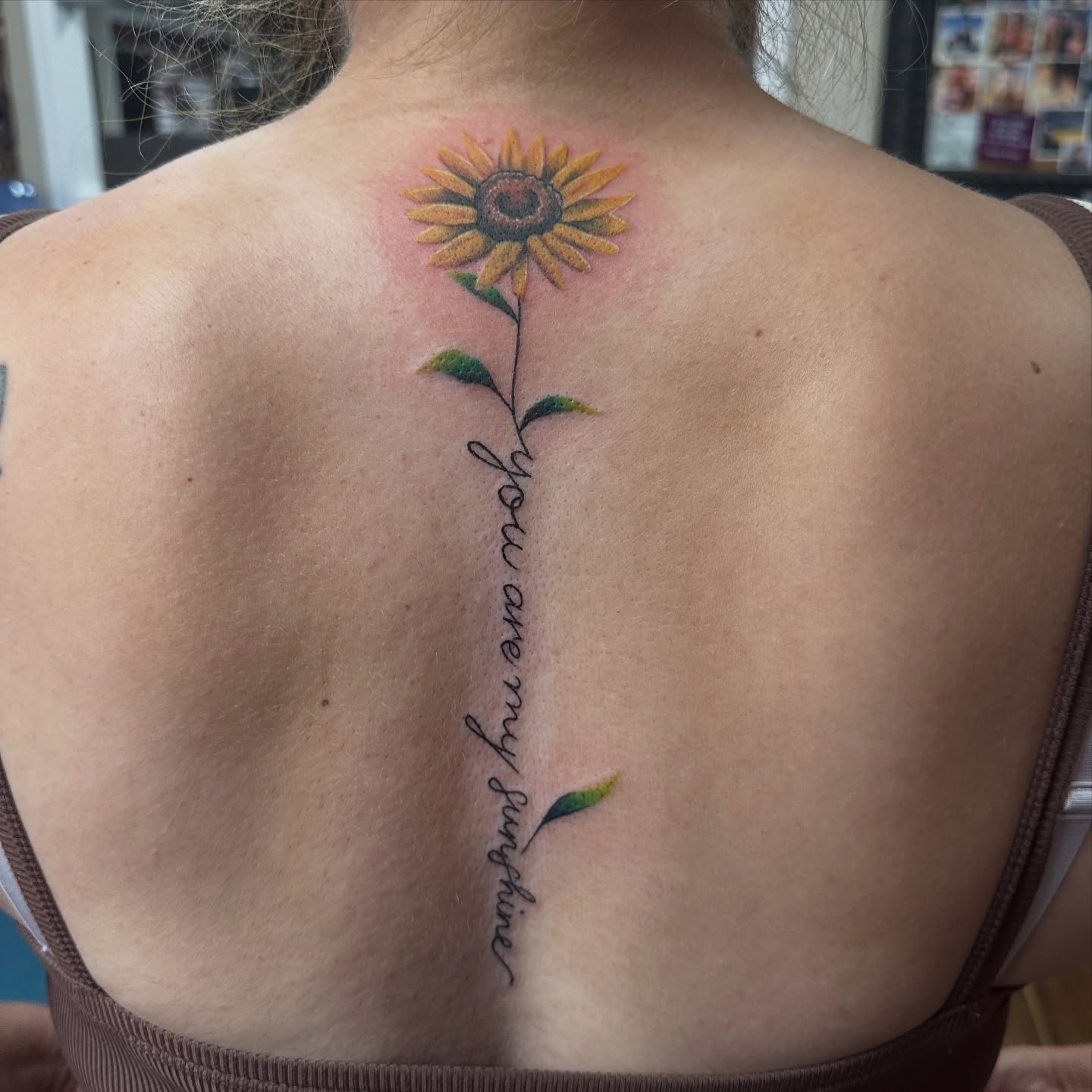 Sunflower realism tattoo on the back by Bosco Layne