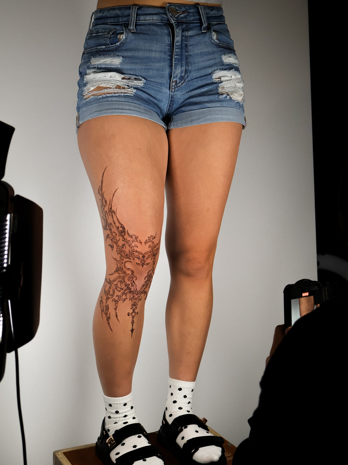 Floral design fine line tattoo on the leg by Grace Zarmina Hessam
