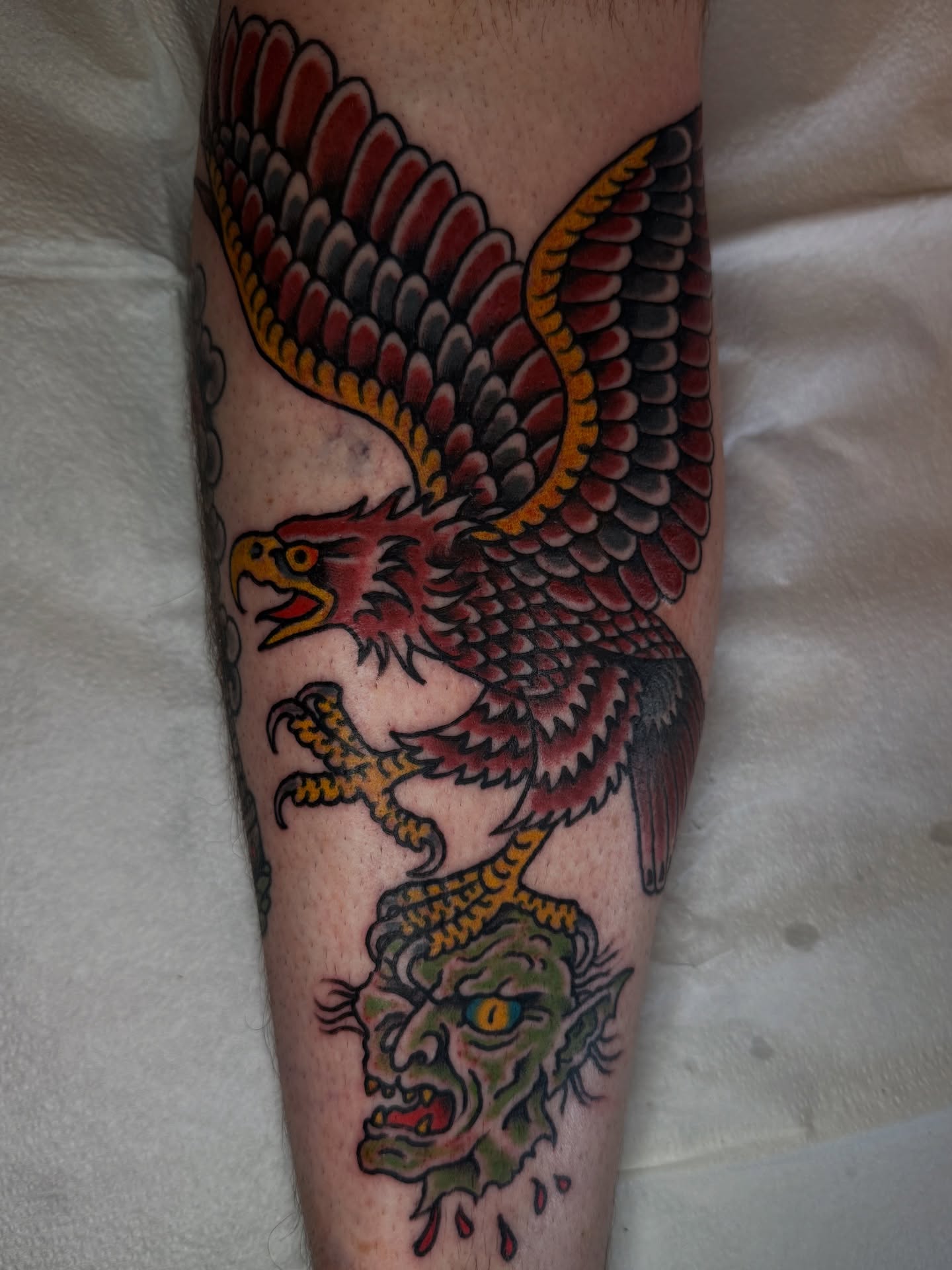 Eagle and dragon American traditional tattoo on the forearm by Jesse Swanson, Santa Rosa, California