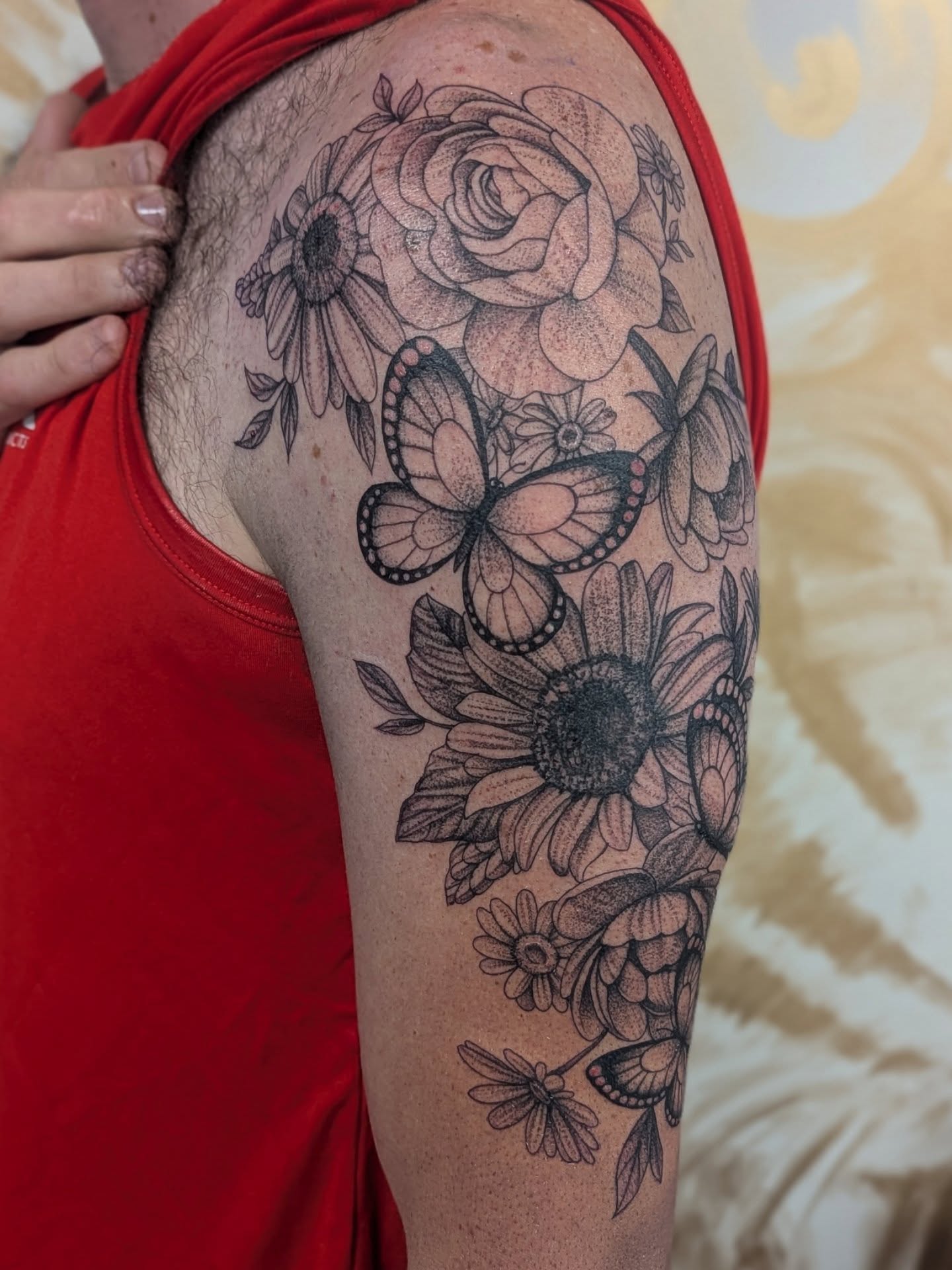 Floral butterfly dotwork tattoo on the upper arm by 💎 Neon
