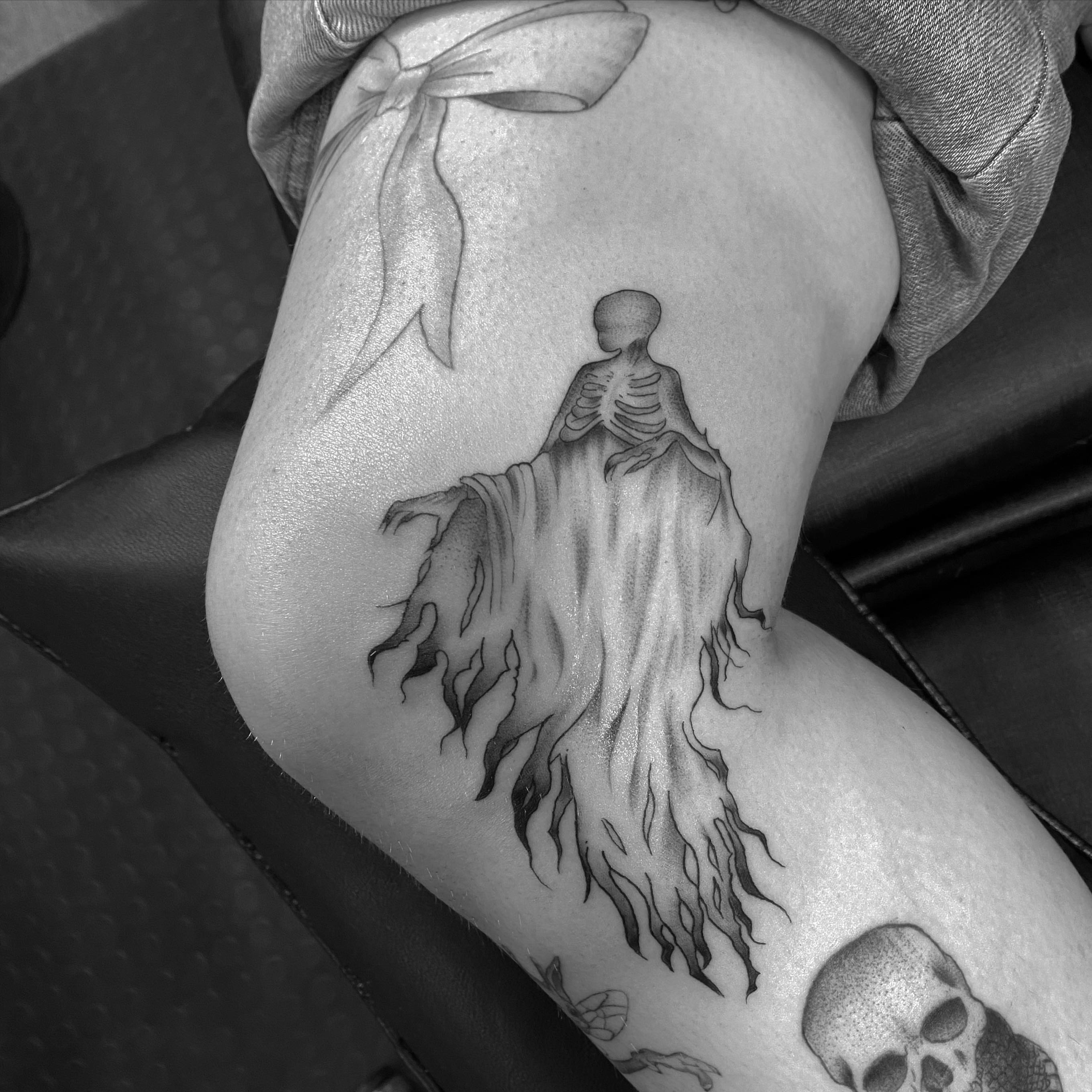 Ghostly skeleton realism tattoo on the thigh by Spencer Jones Tattoos