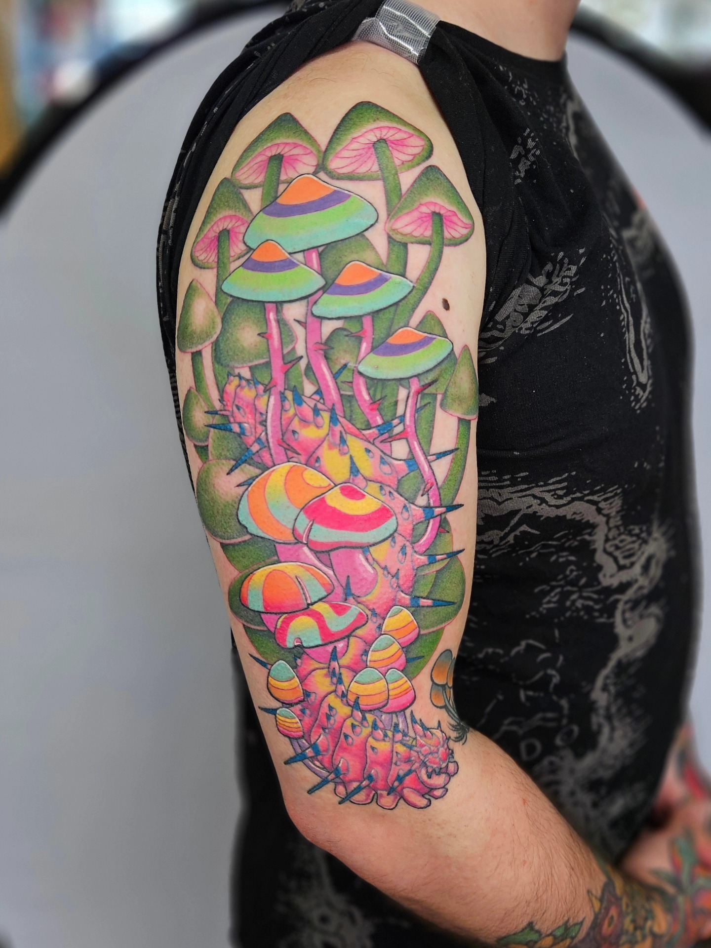 Psychedelic mushrooms new school tattoo on the forearm by Bellz Rehder