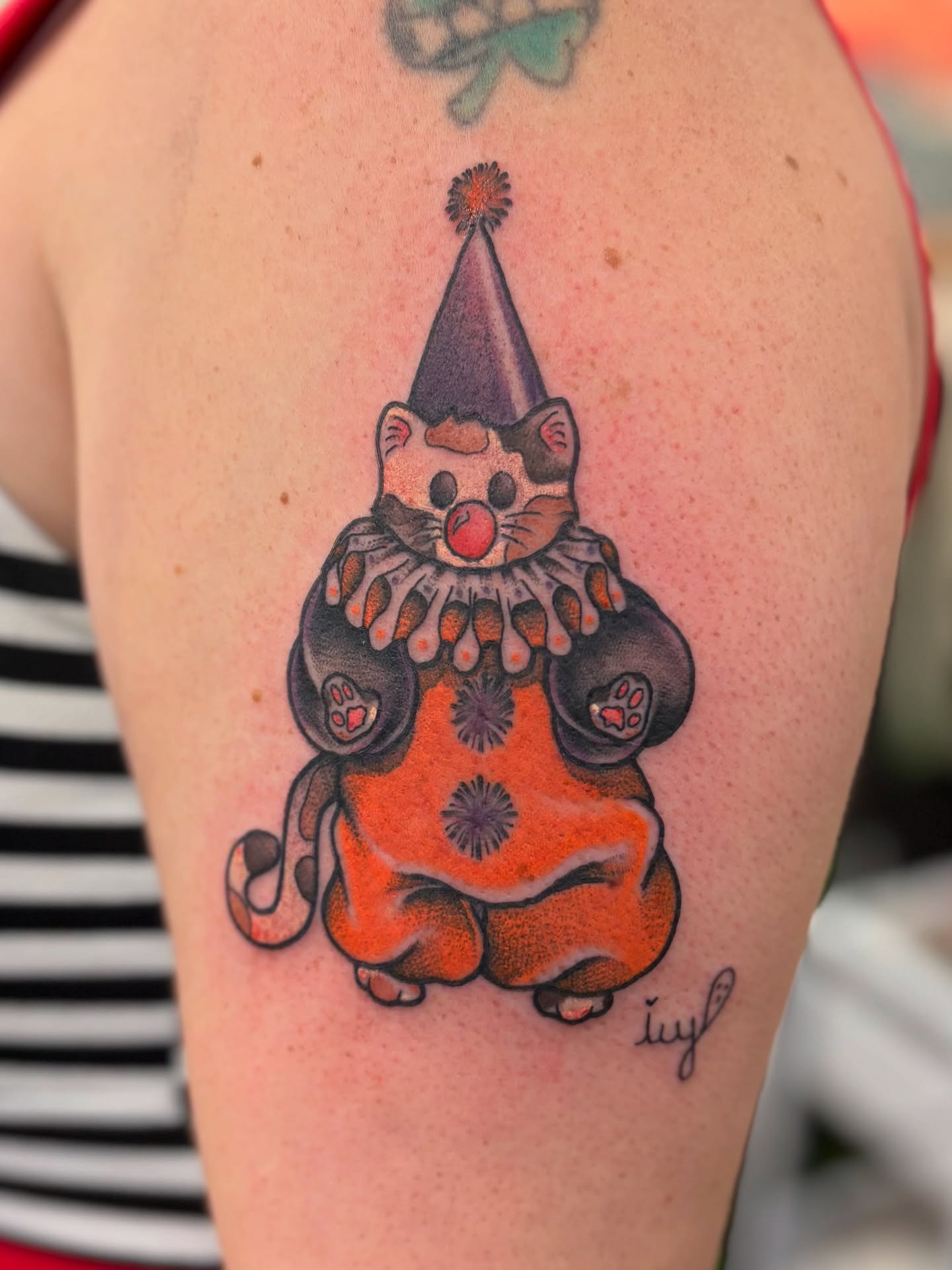Clown cat American traditional tattoo on the upper arm by Dee - MA Tattoo Artist, Concord, Massachusetts