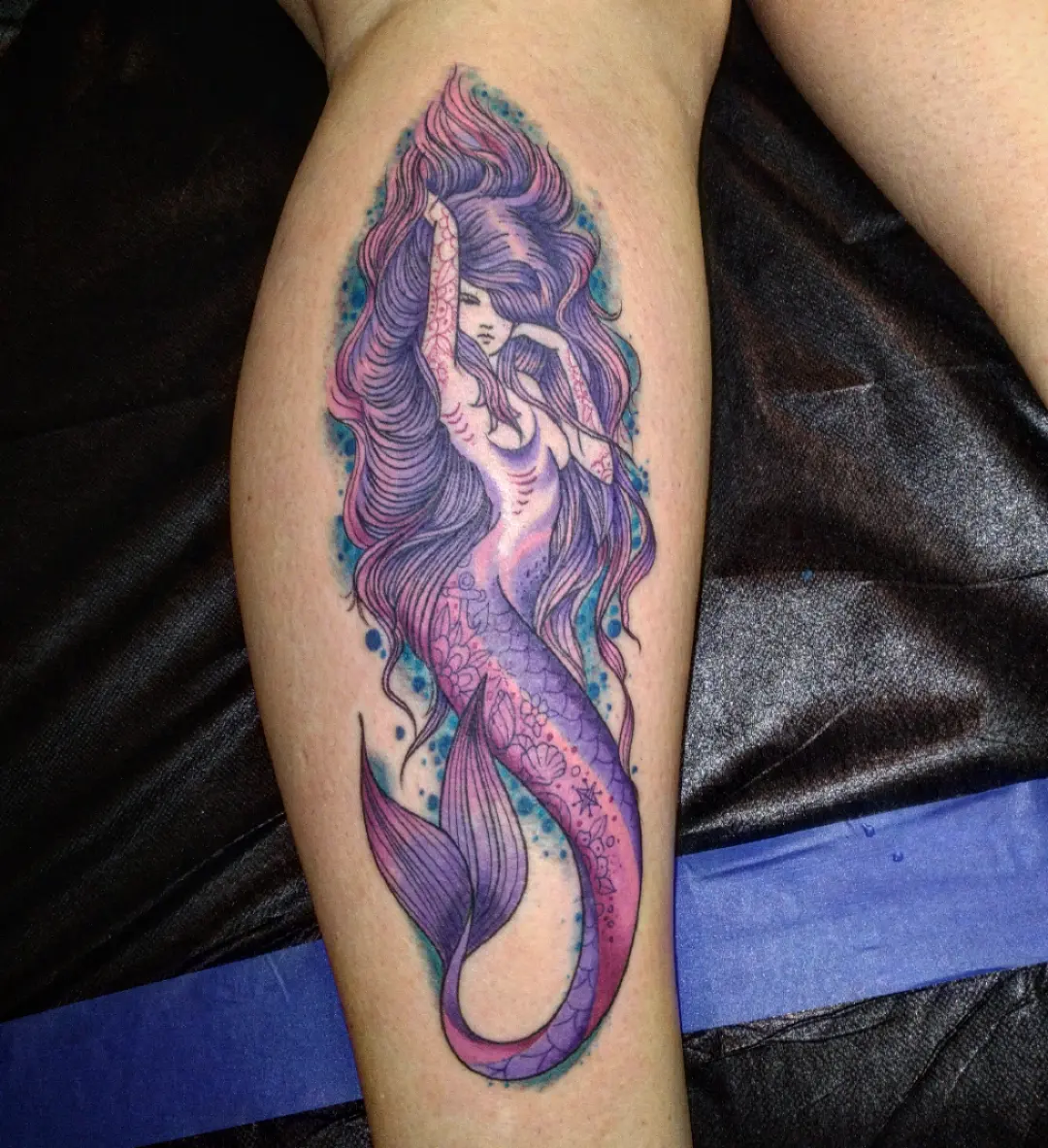 Mermaid watercolor tattoo on the forearm by Josh Sroga