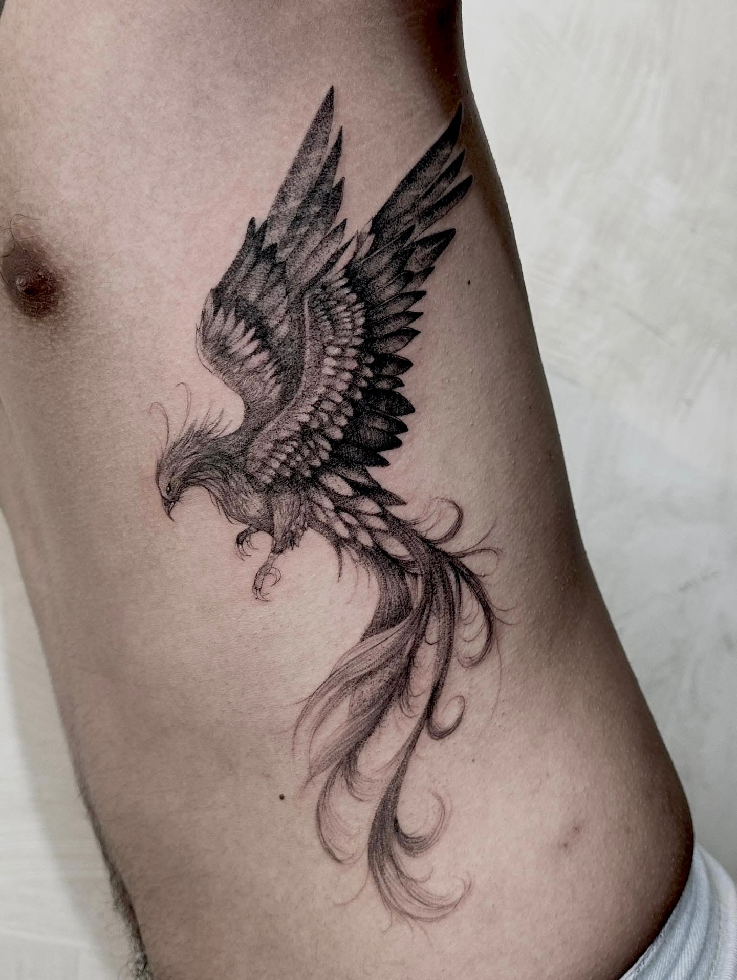 Phoenix black and grey tattoo on the thigh by Arhem Quiambao