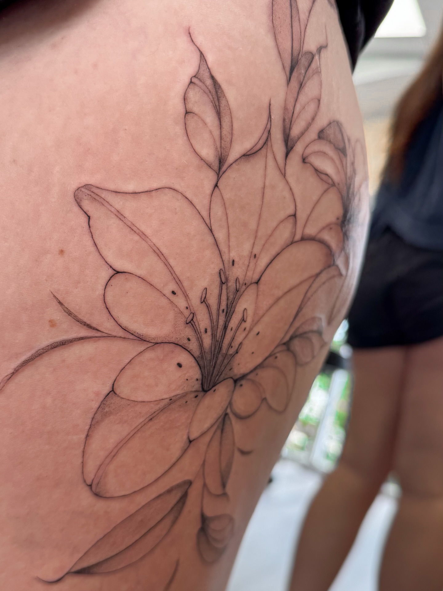 Flower black and grey tattoo on the shoulder by Daniel Montoya, Charlotte, North Carolina